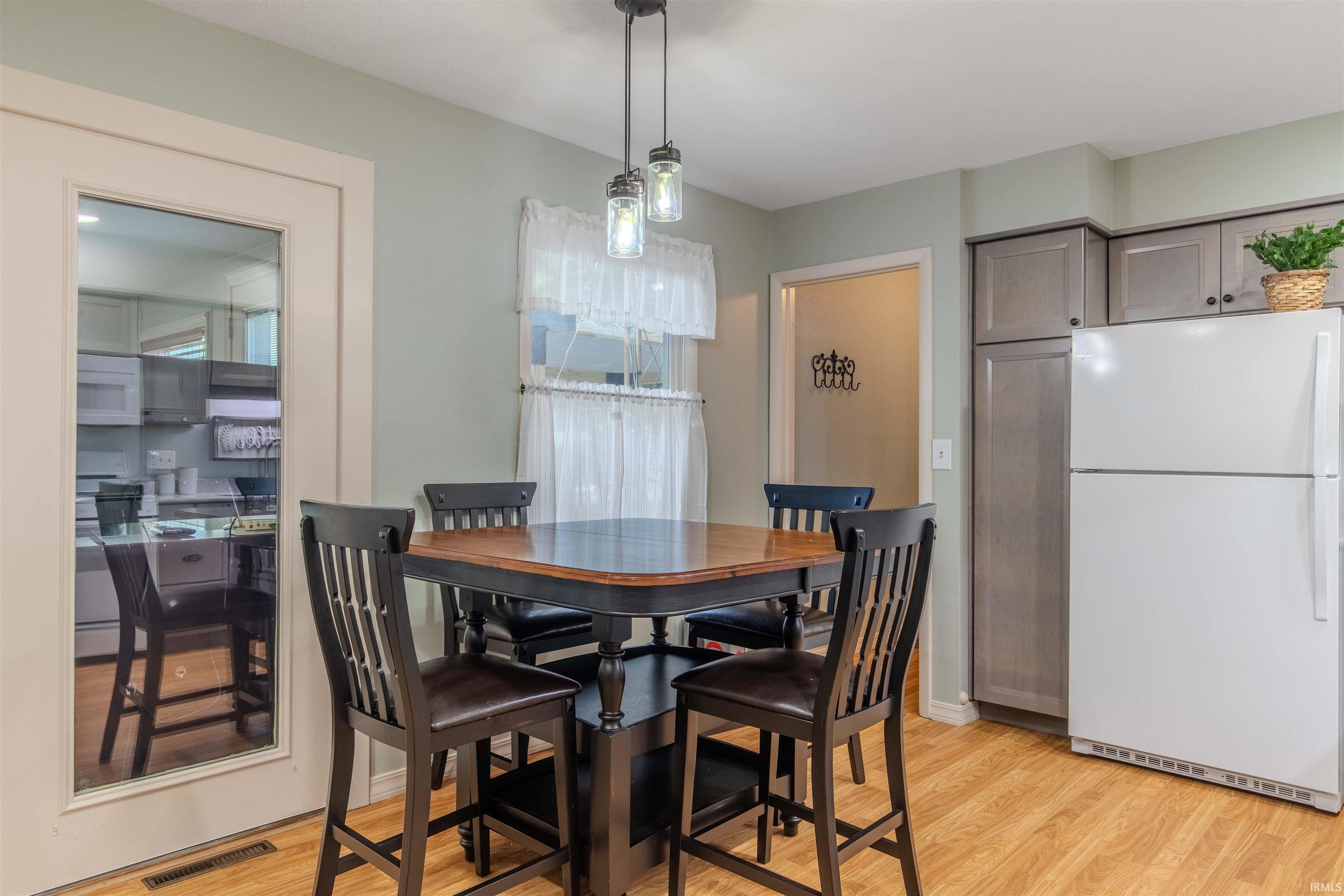 Dining room featuring light wood-type flooring