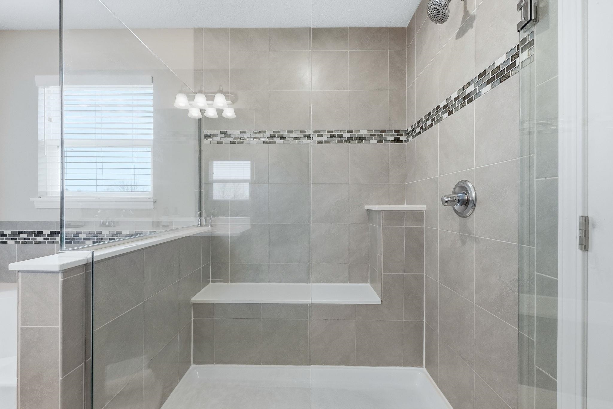 Full bathroom featuring a stall shower