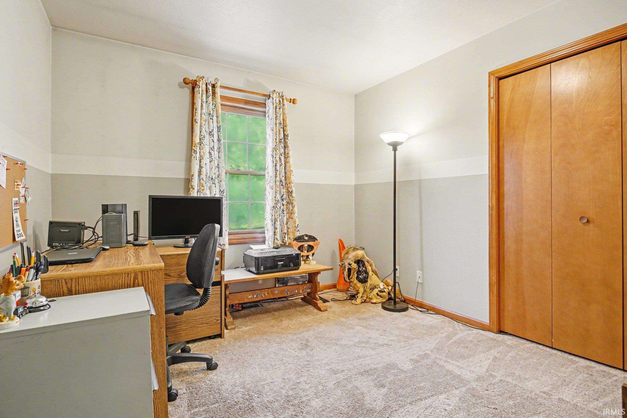 Office space featuring light colored carpet