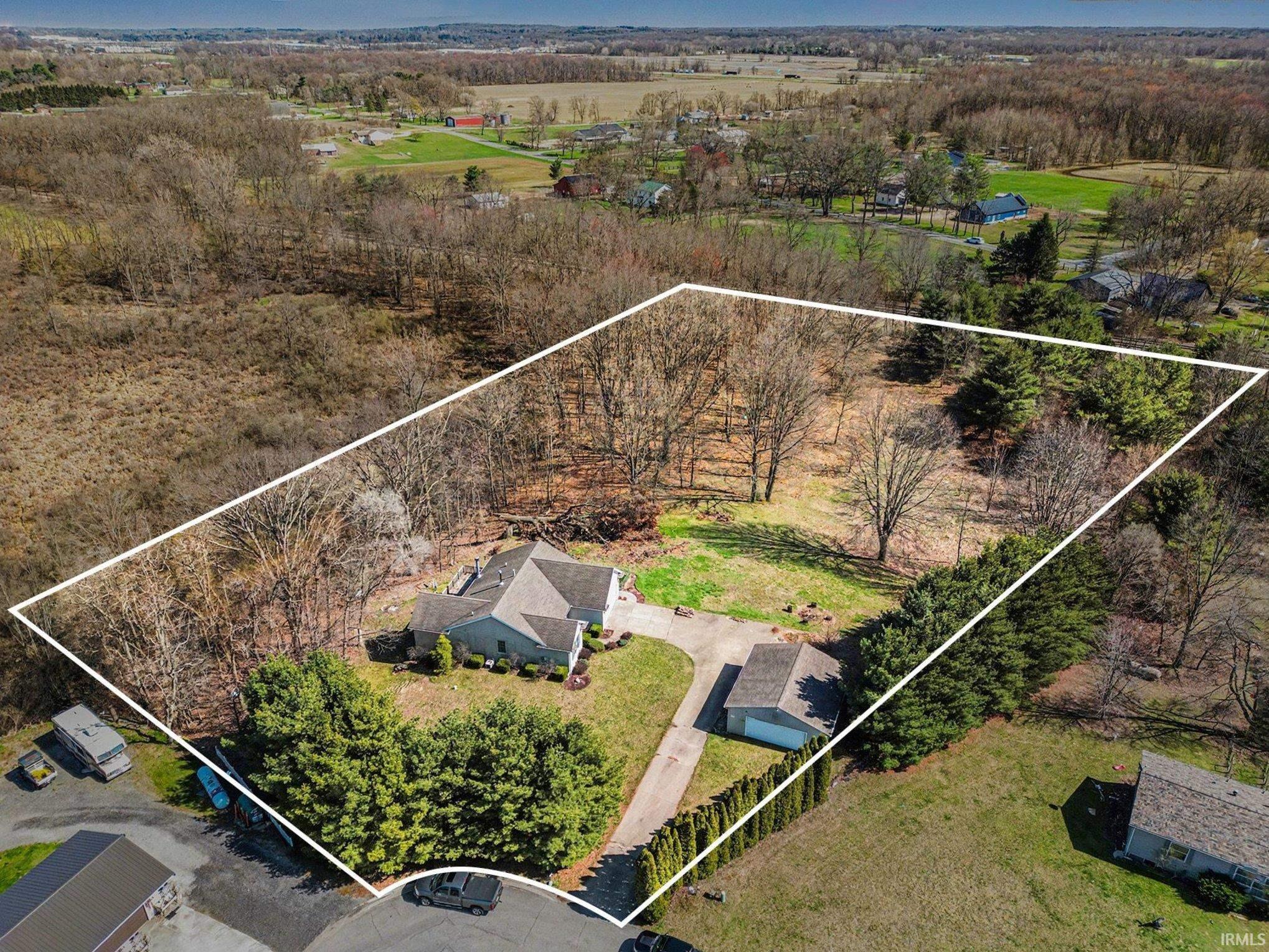 Aerial view of property and surrounding area with property boundaries highlighted