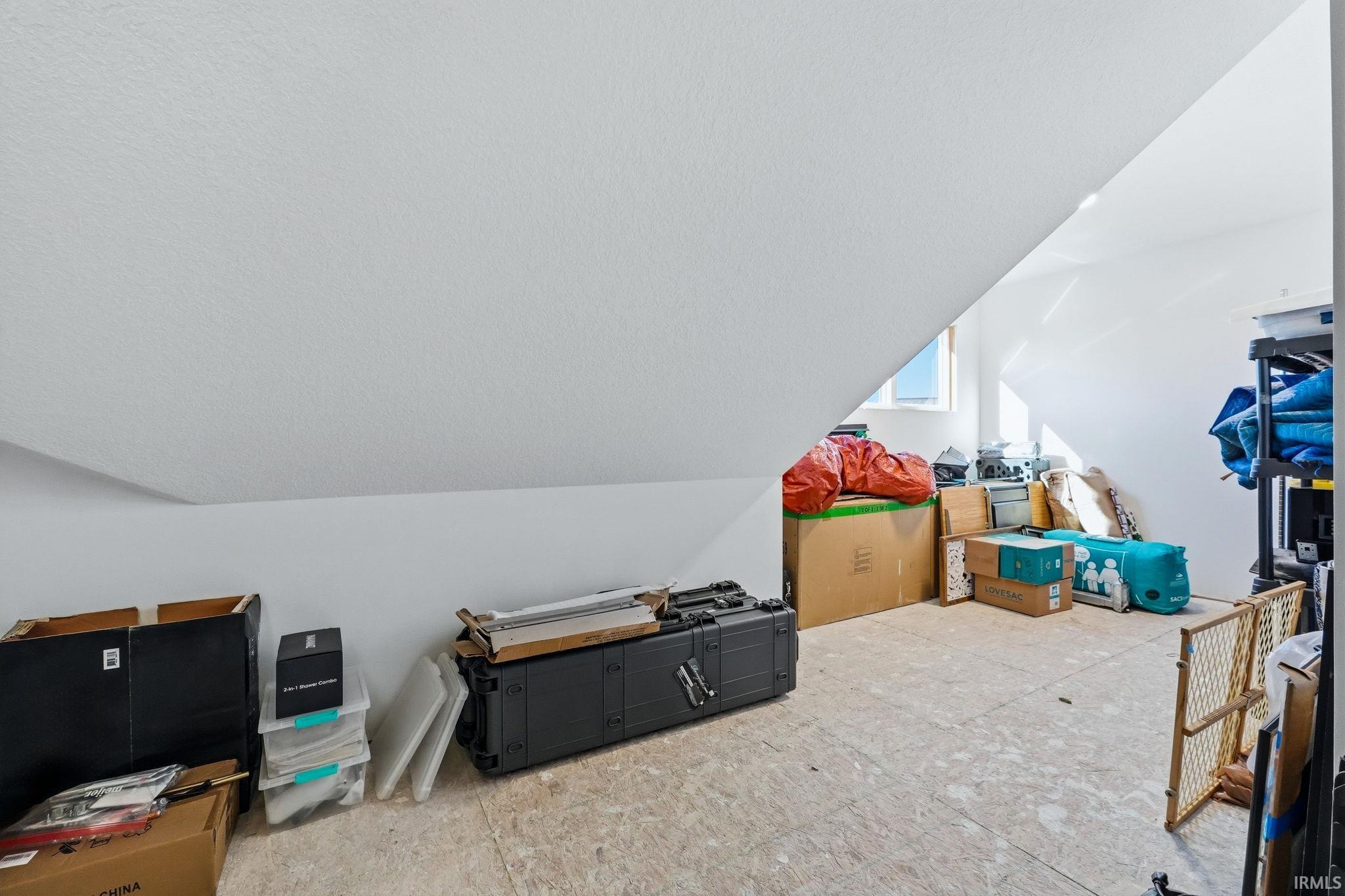 Bonus room featuring lofted ceiling