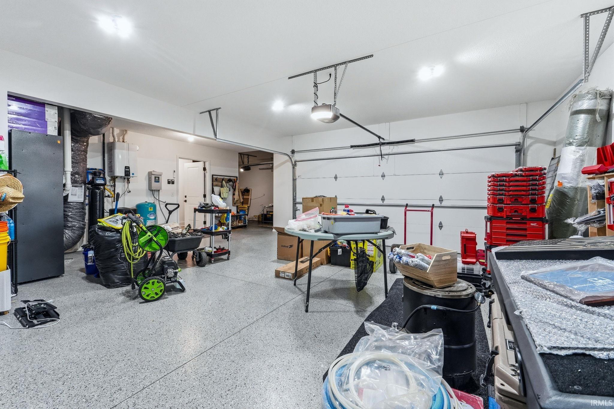 Garage featuring tankless water heater
