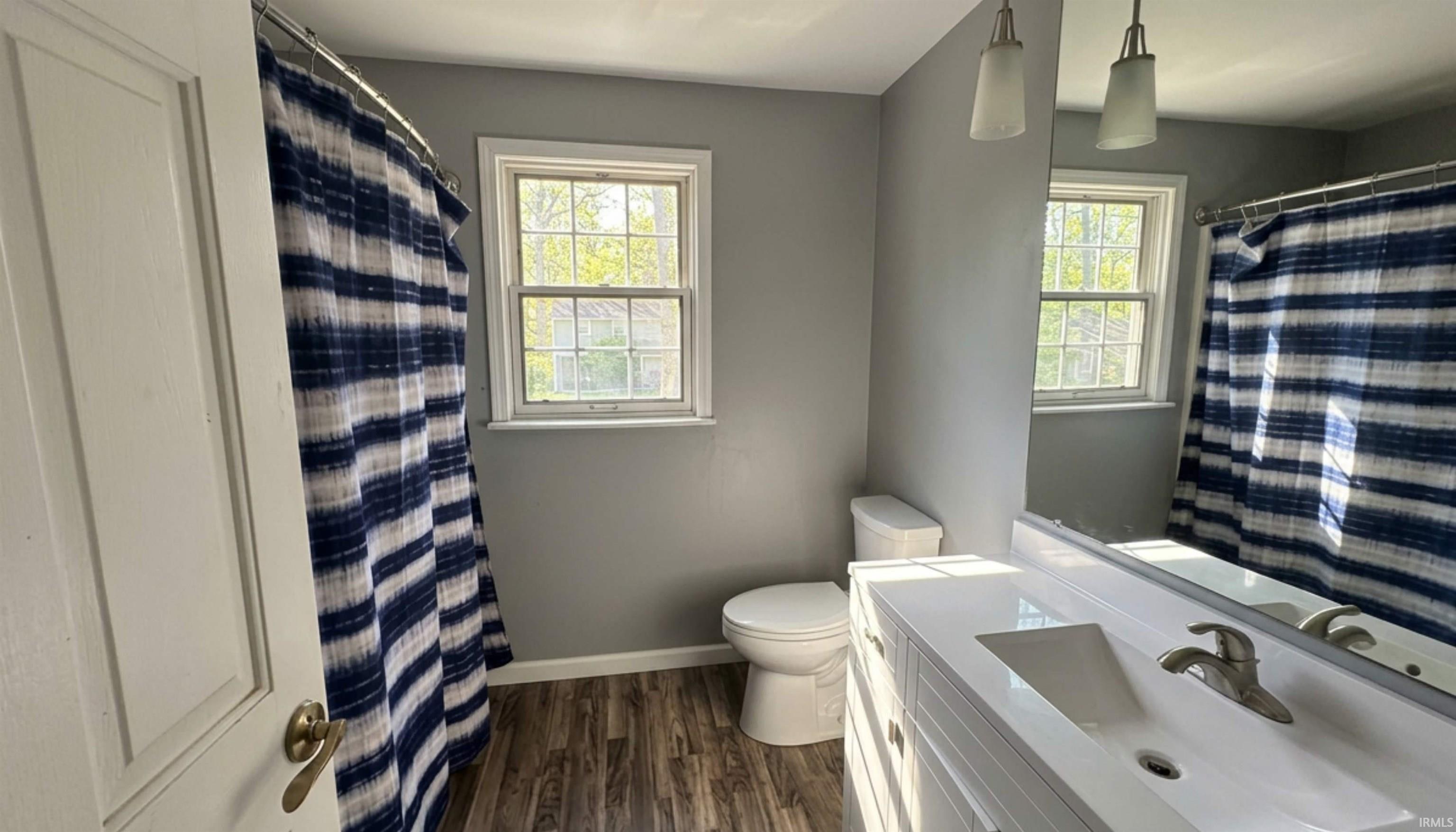 Completely renovated in 2021! Wood flooring, sleek light fixtures.