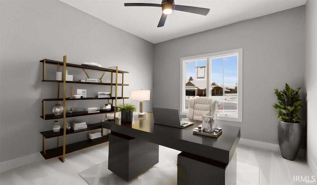 Office space with baseboards and a ceiling fan