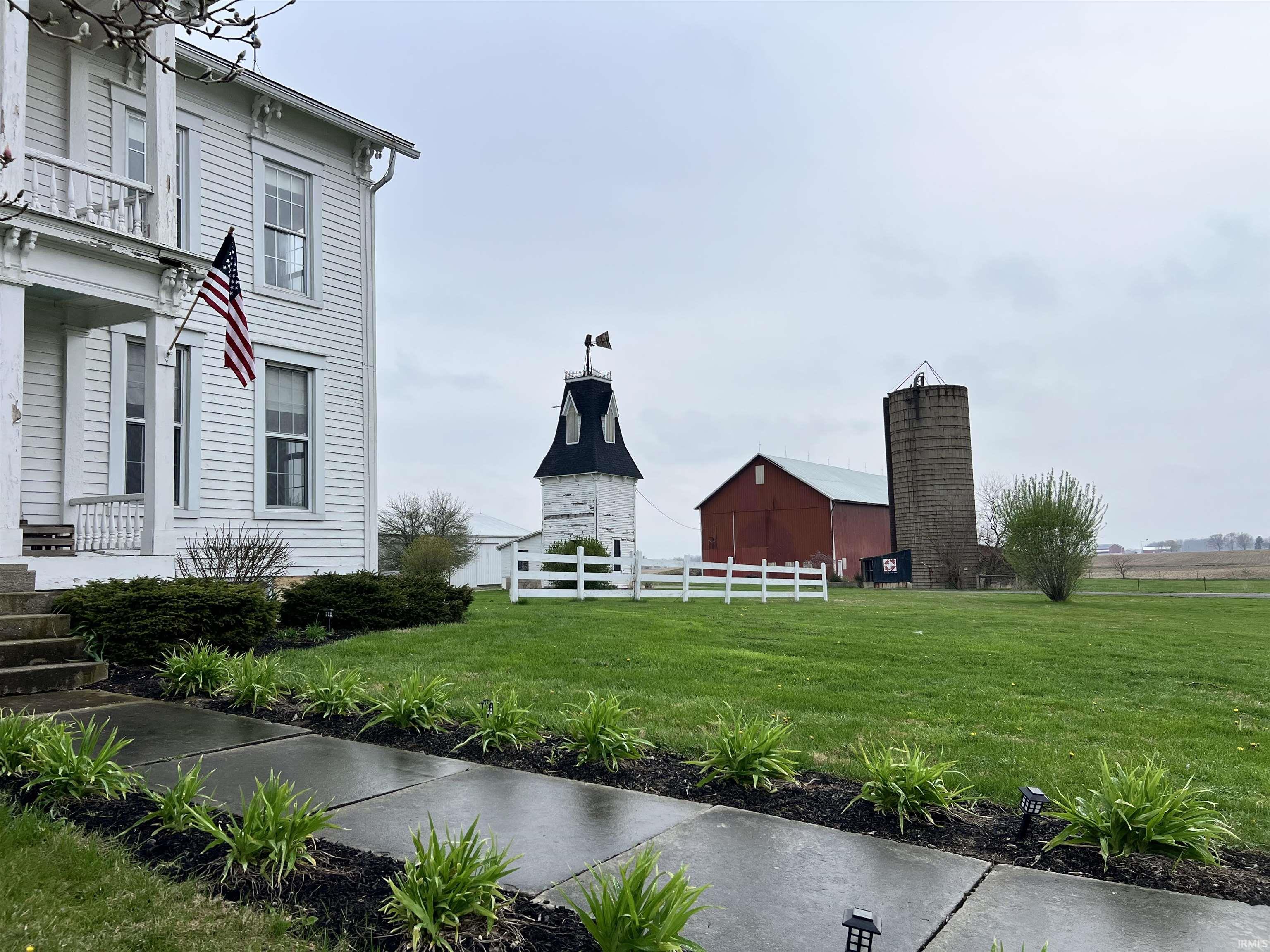 View of yard with an outdoor structure and a barn