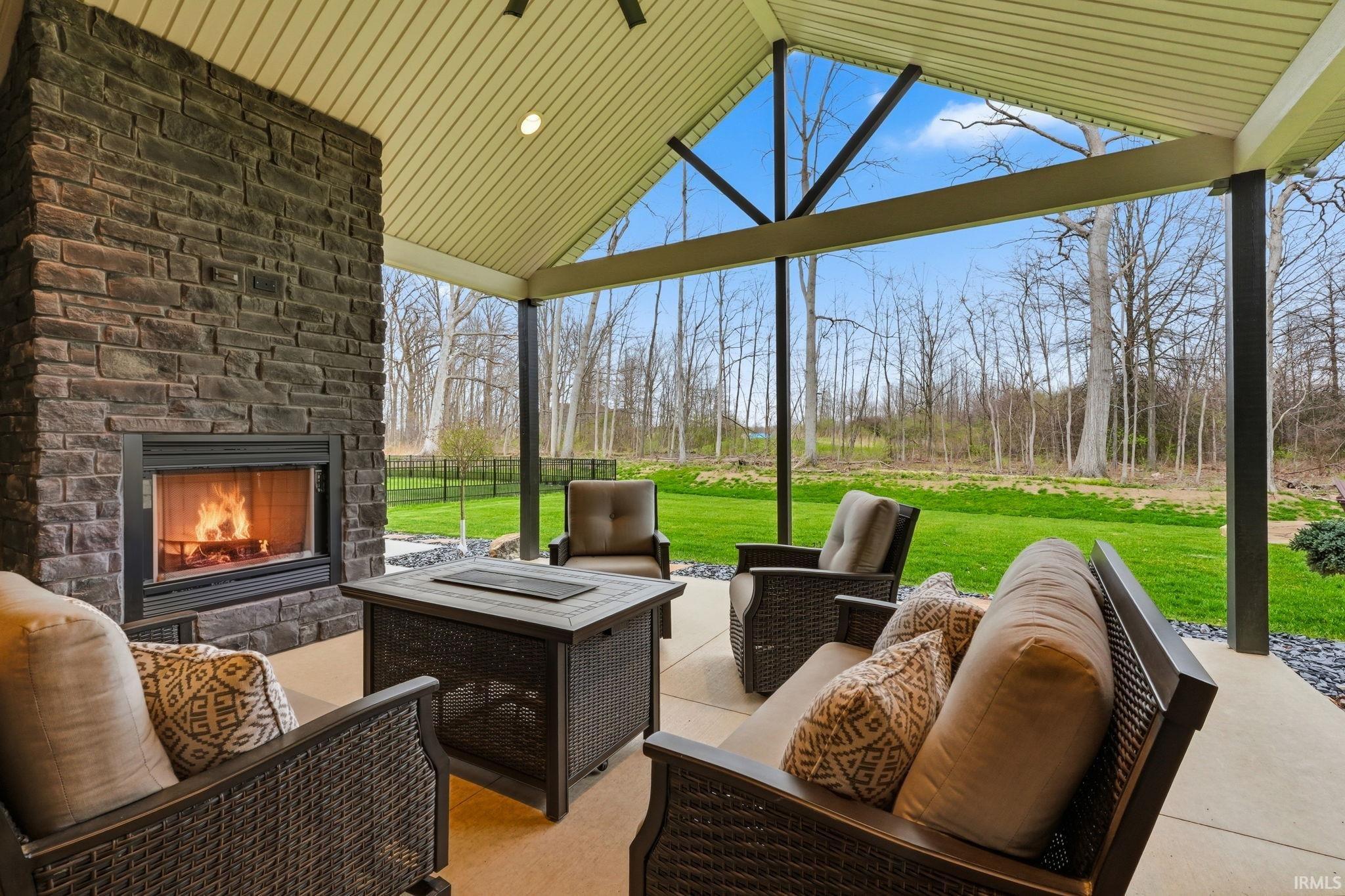 View of patio featuring an outdoor living space with a fireplace