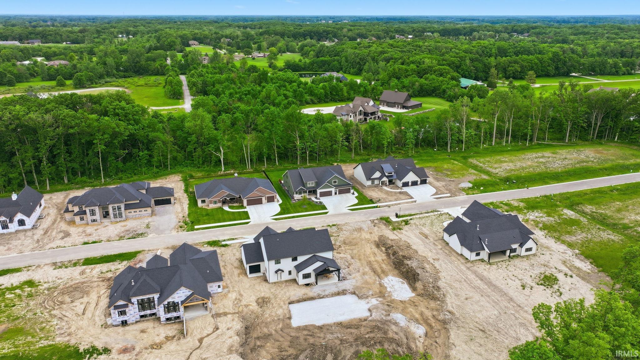 Newly constructed residences with modern architecture, dark-toned roofs, and attached garages