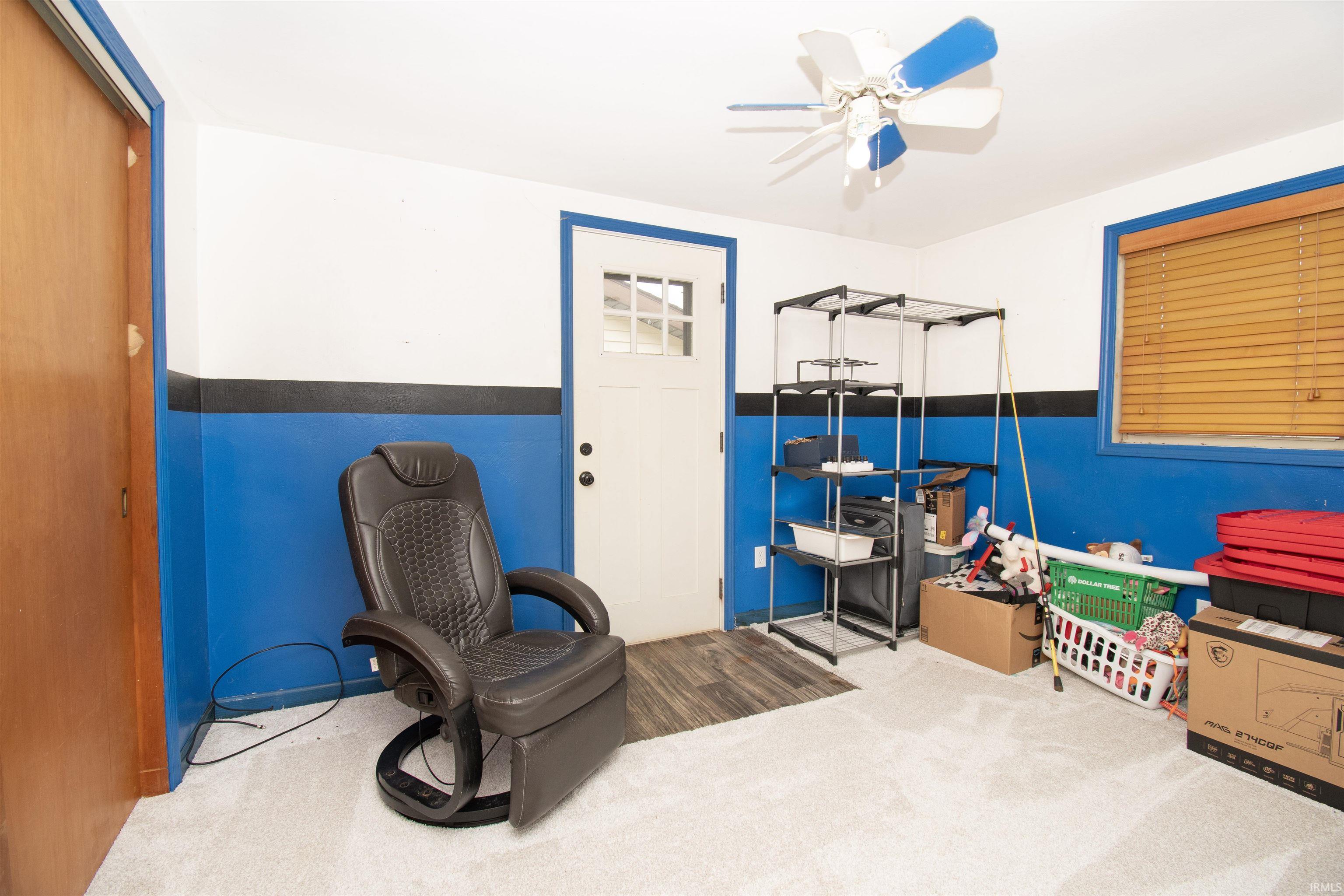 Bedroom featuring ceiling fan and light carpet