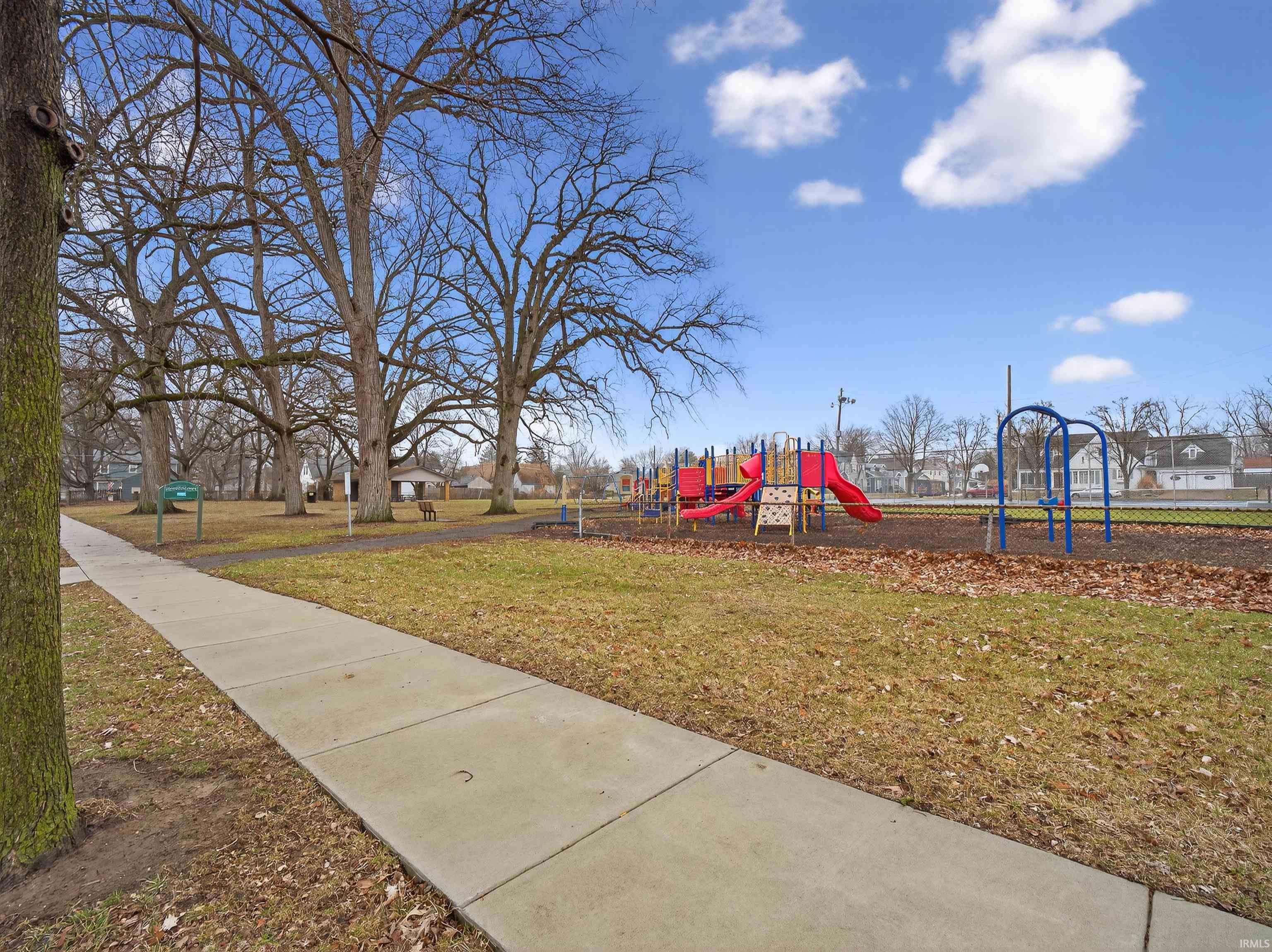 Community playground with a yard