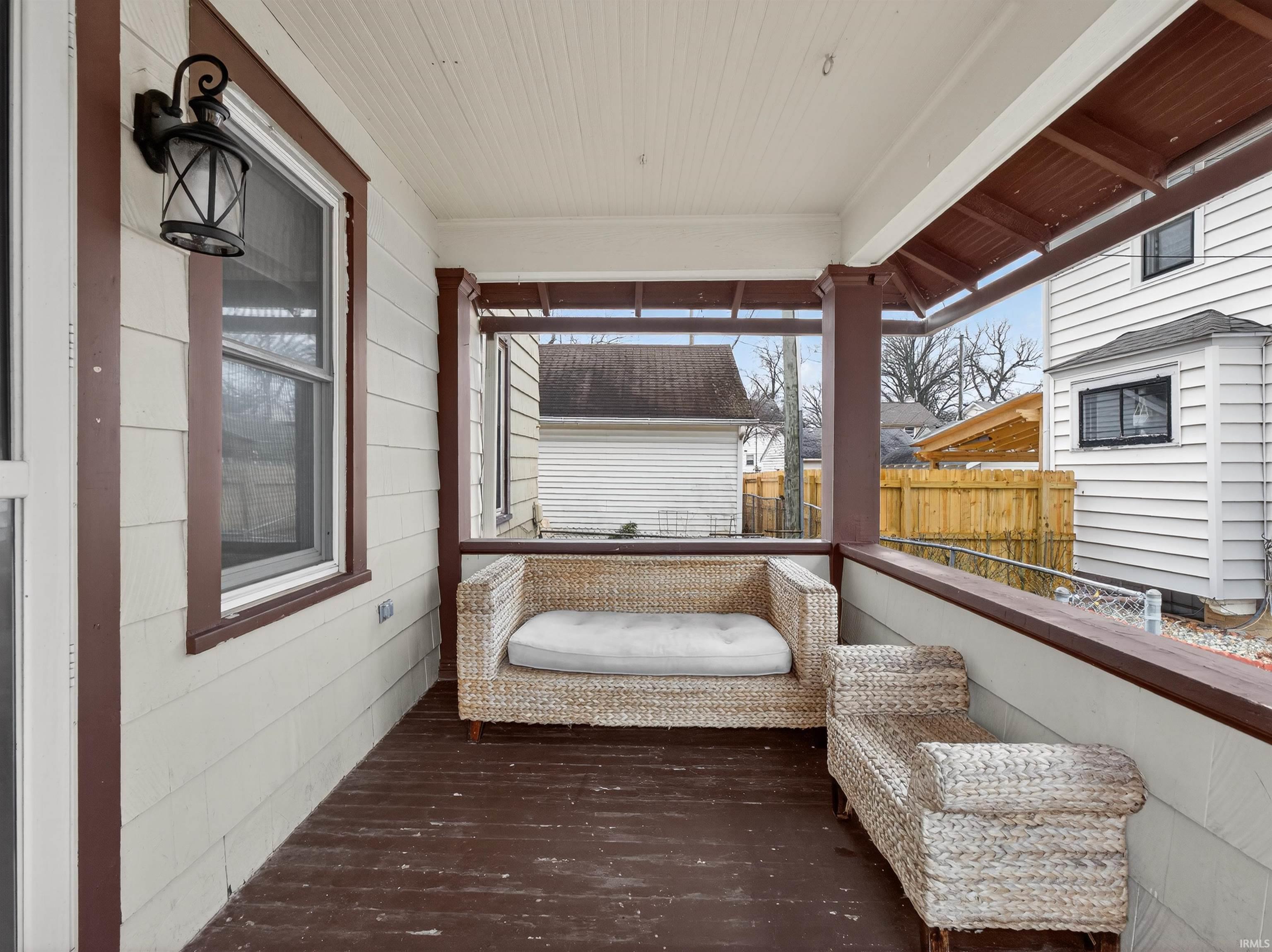 Sunroom with hardwood / wood-style flooring and wooden ceiling