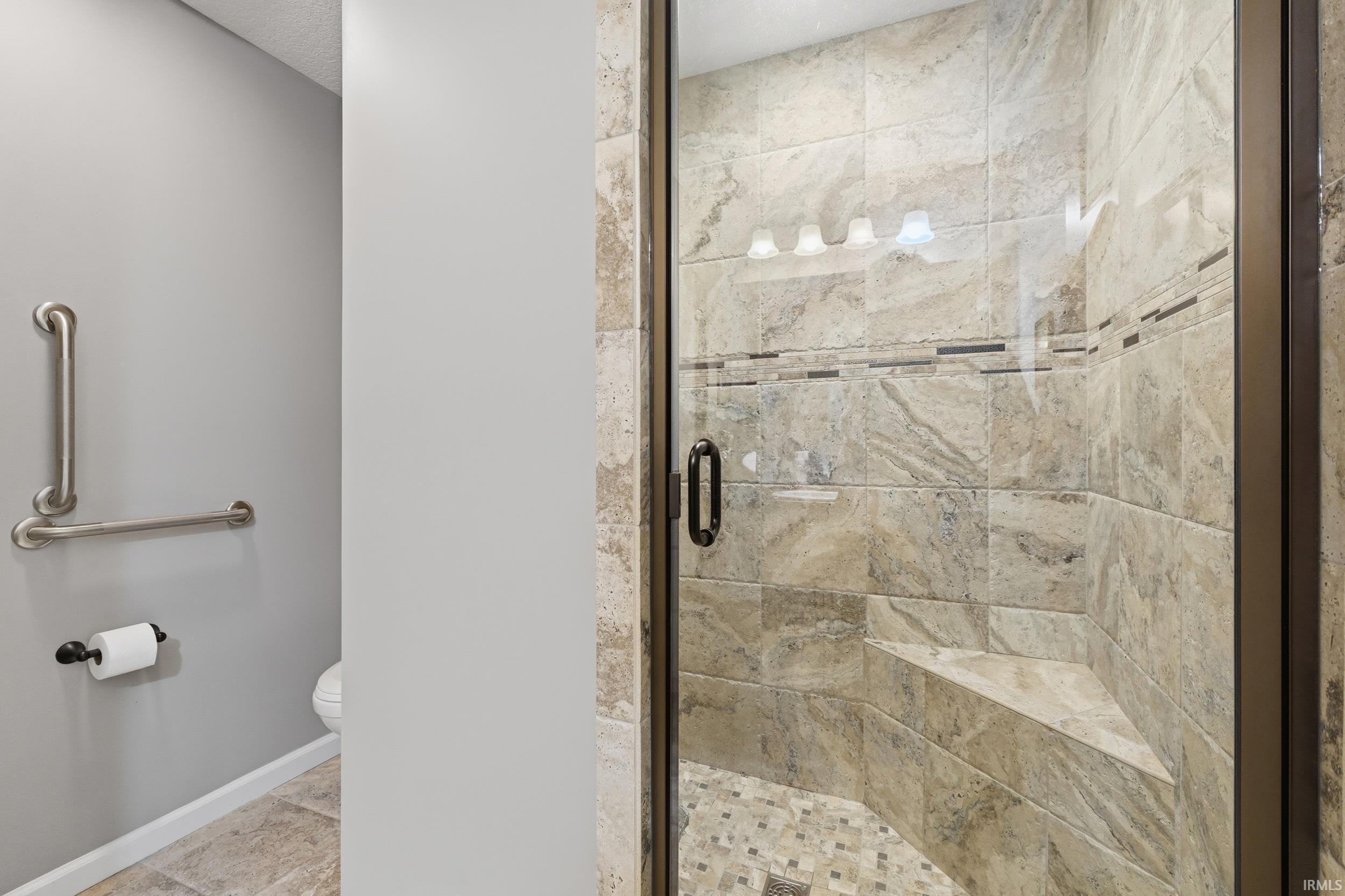 Bathroom with toilet and a shower stall