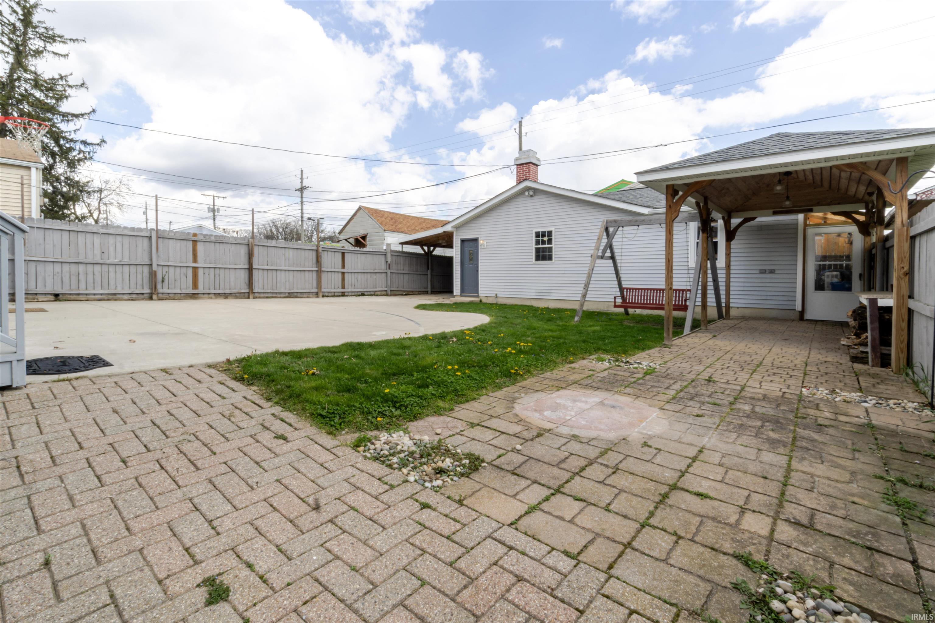 Fenced backyard featuring a patio