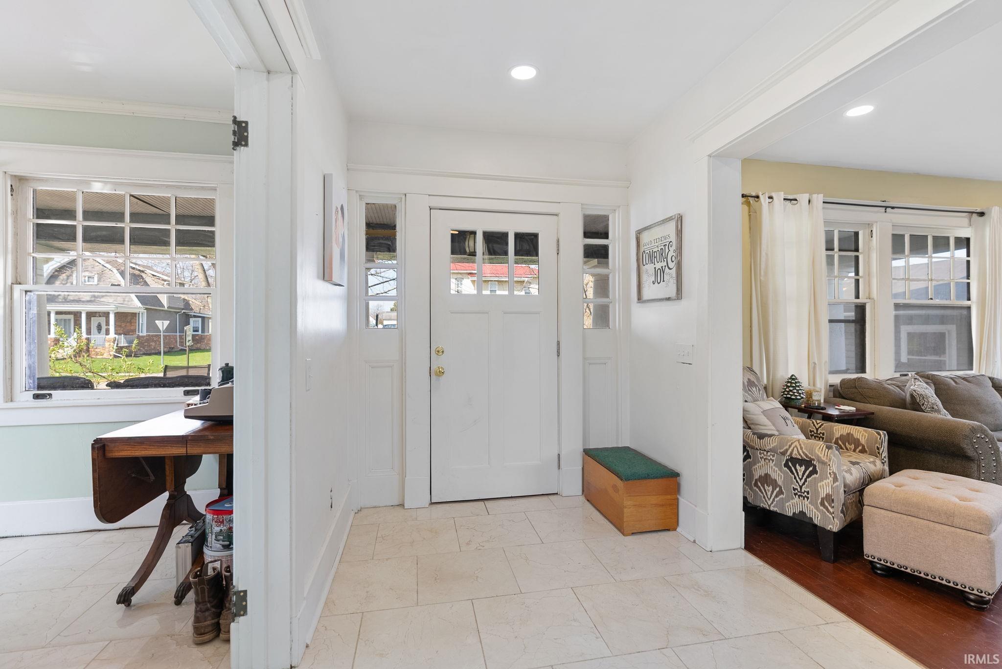 Foyer featuring healthy amount of natural light and recessed lighting