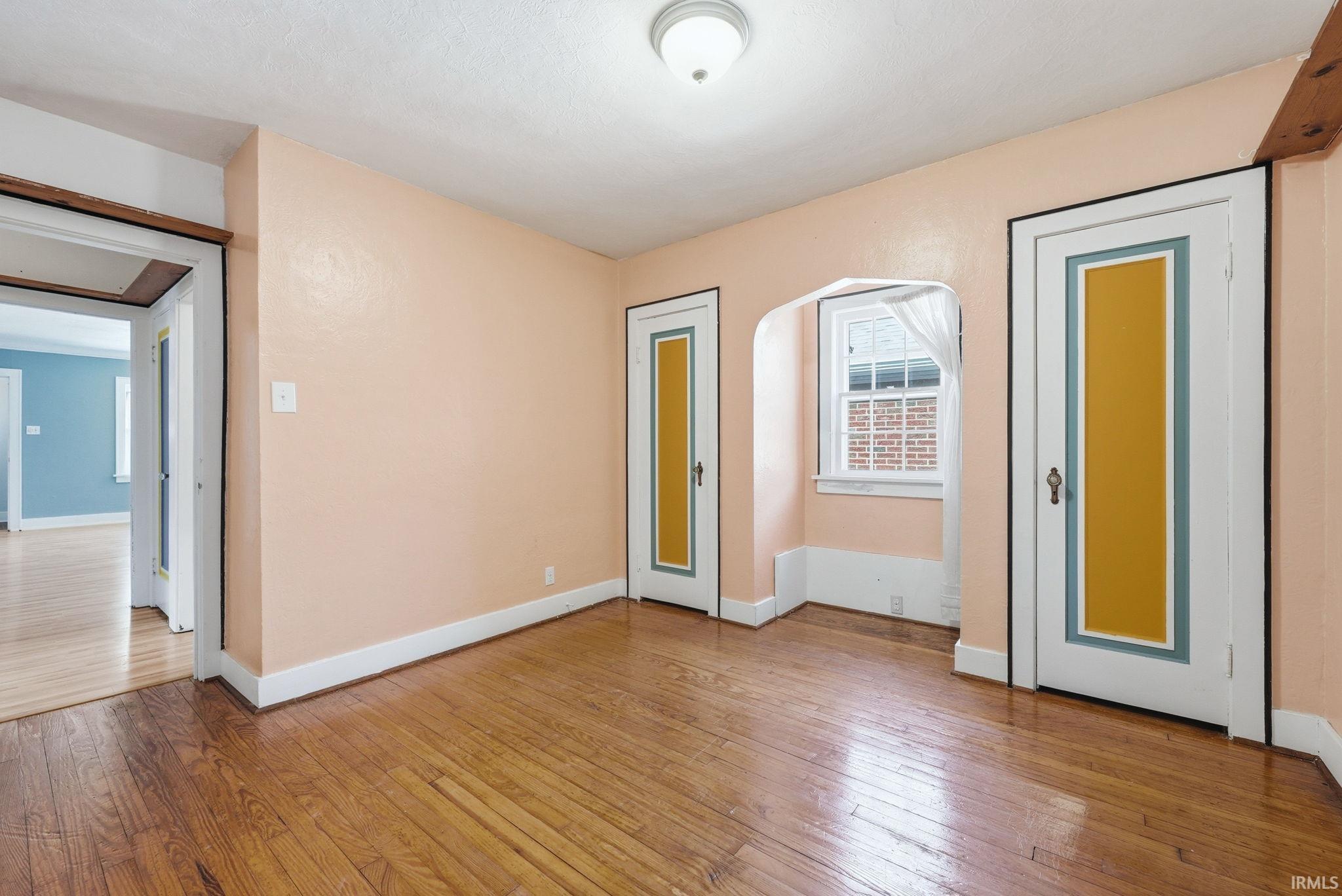 Spare room with light wood finished floors and baseboards