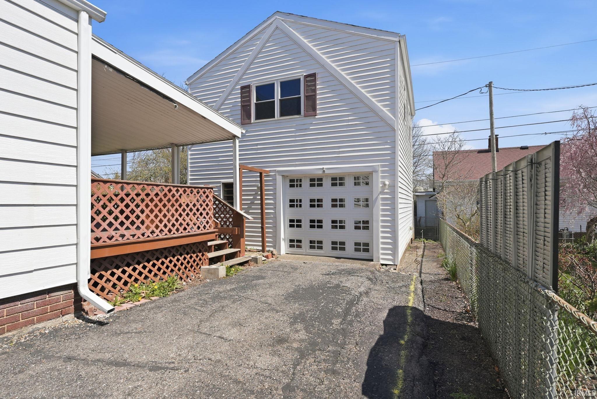 Garage featuring driveway