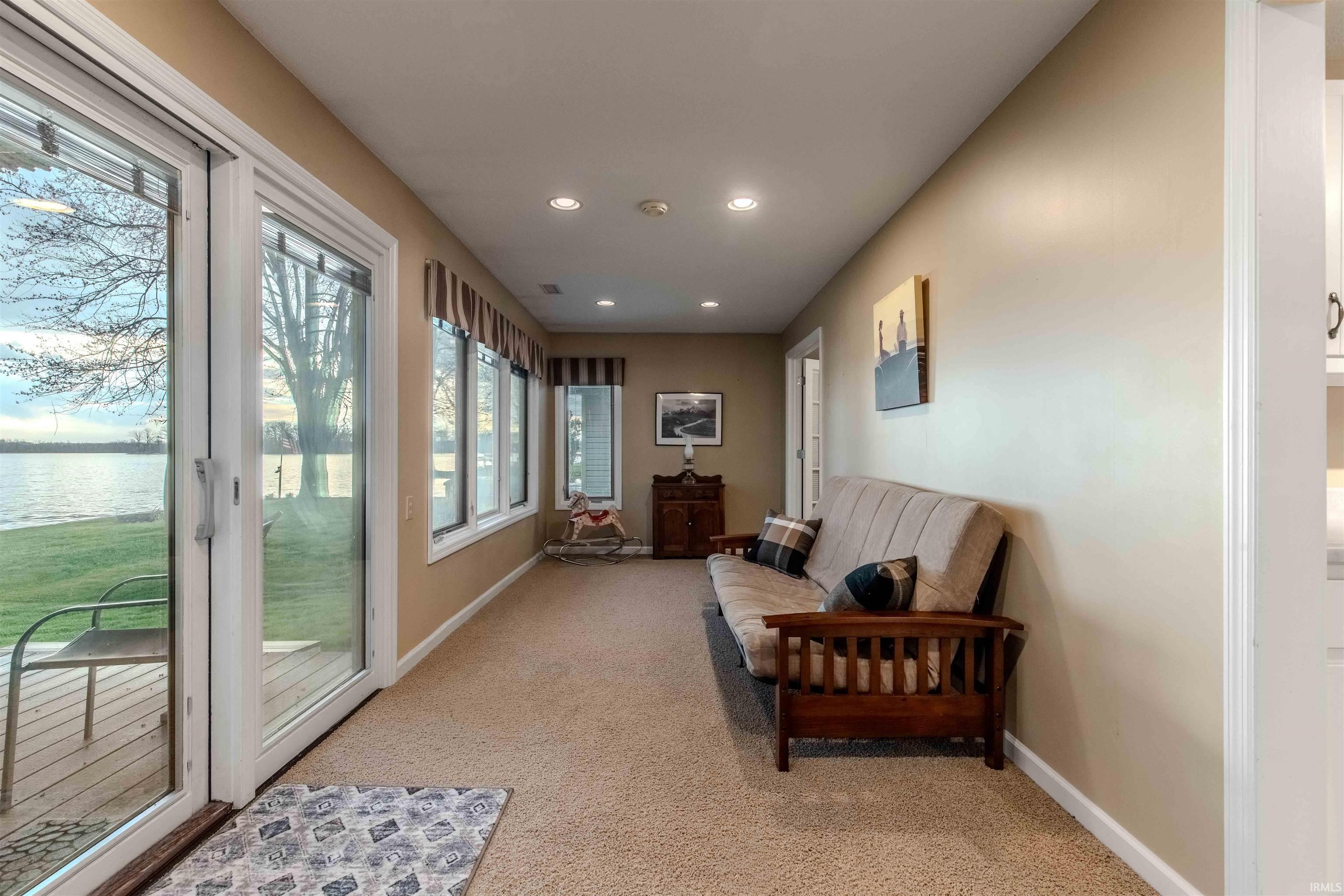 Custom finished sunroom w/Pella IN window blinds & a gorgeous Lake view