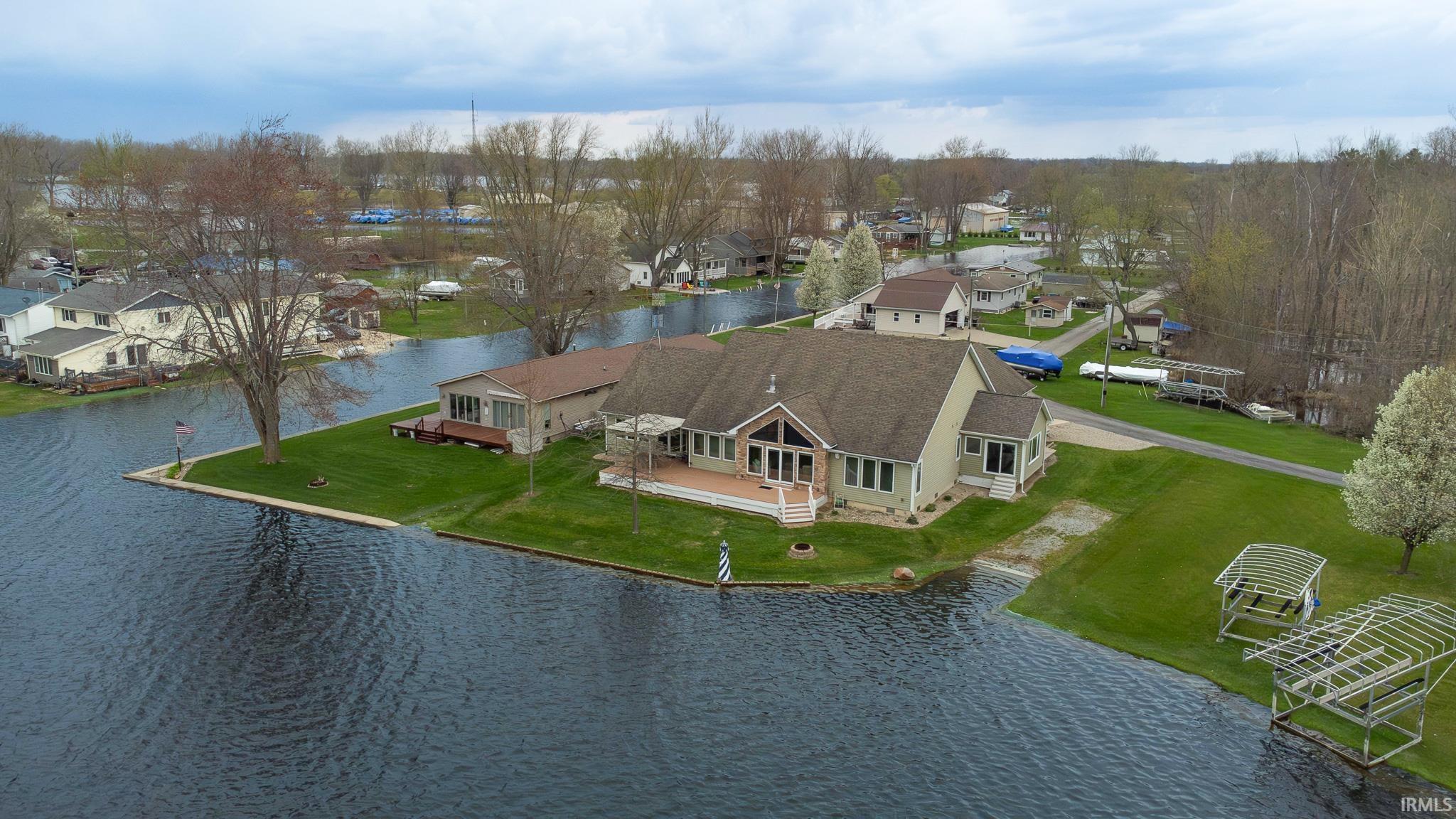 Drone / aerial view northwest and next channel beside the home.