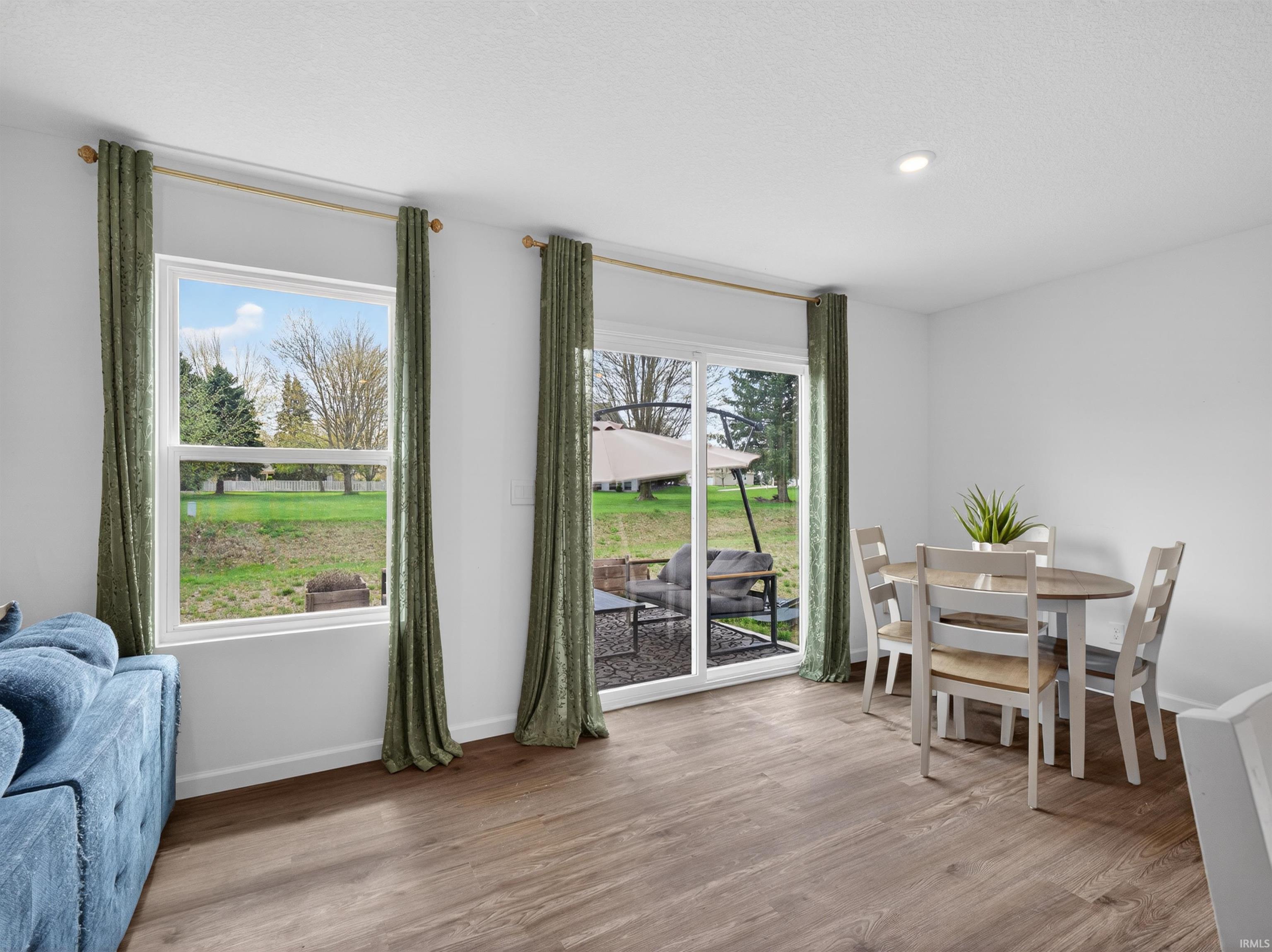 Dining room with light wood-style flooring and baseboards