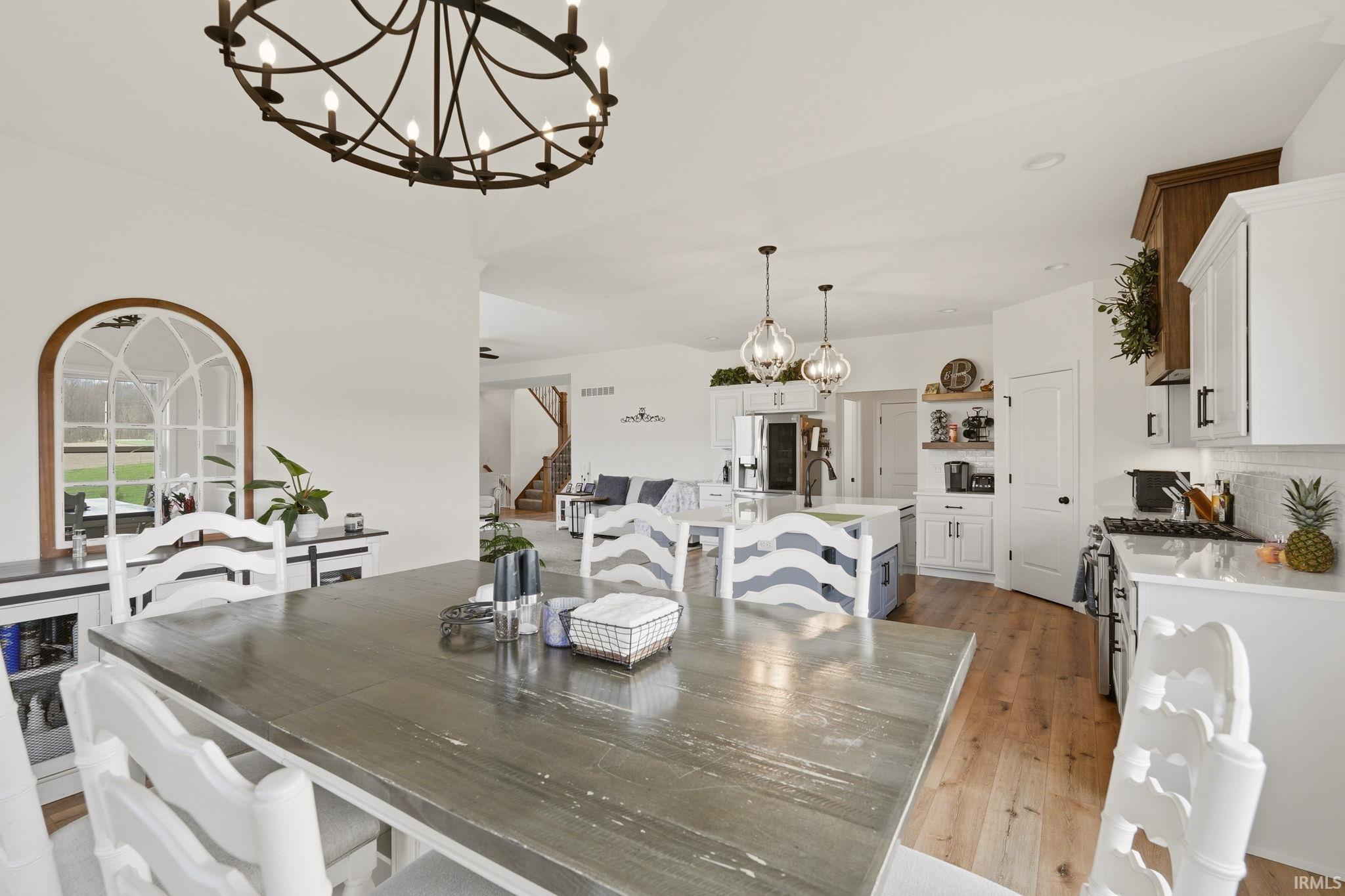 Dining room with a chandelier and light wood finished floors