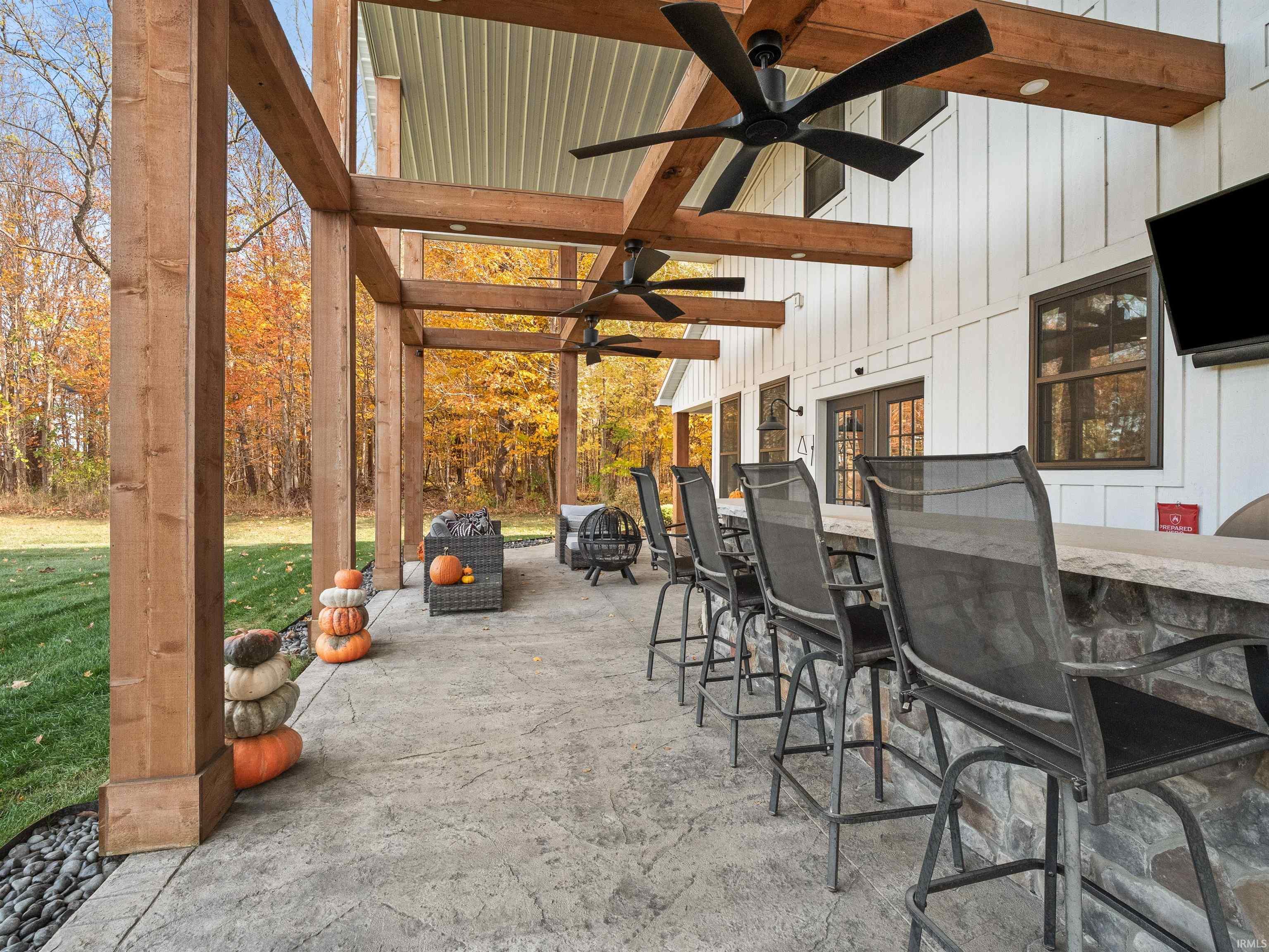View of patio with a ceiling fan and french doors