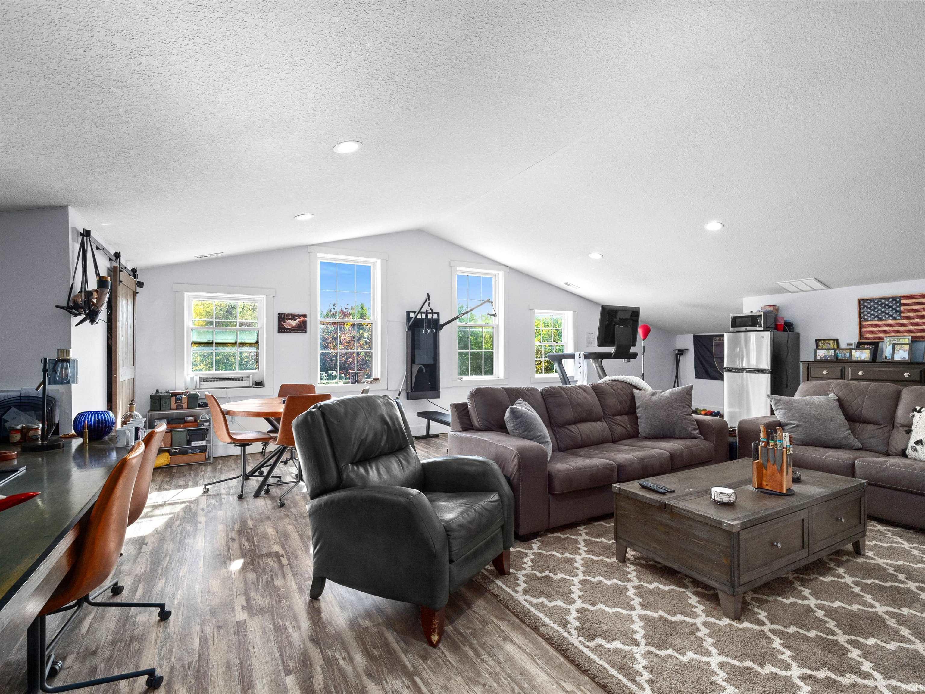 Living room featuring wood finished floors and a textured ceiling