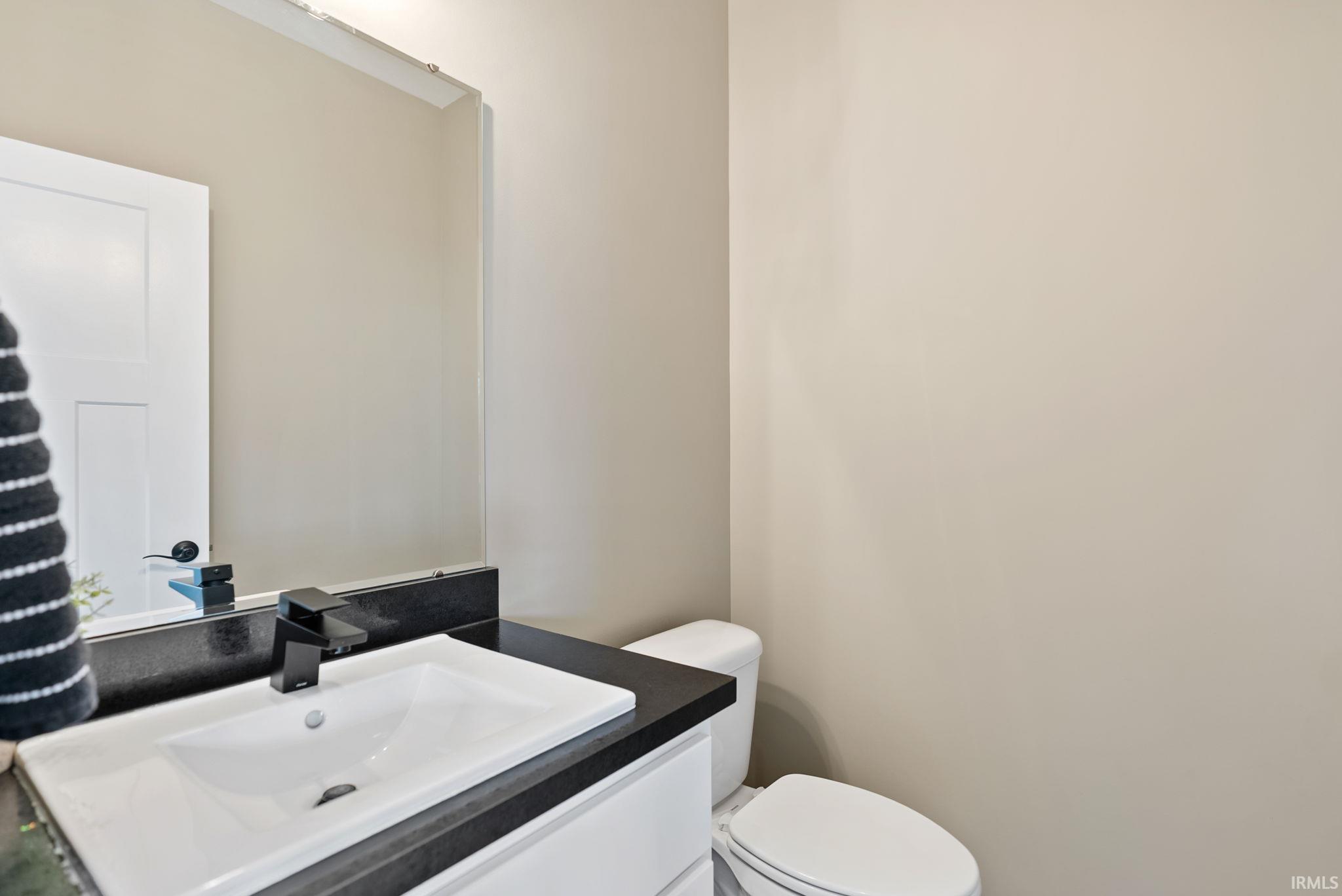 Bathroom with vanity and toilet