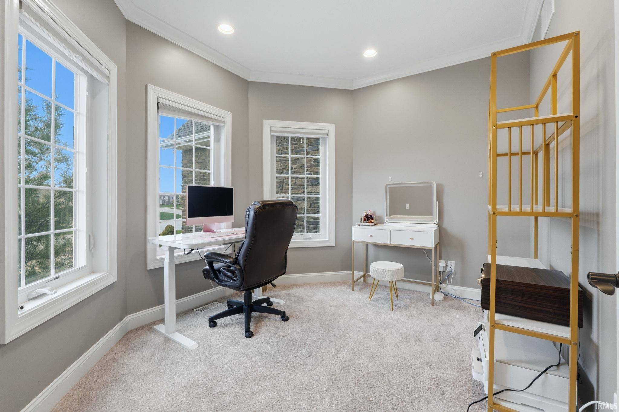 Office with ornamental molding, light carpet, and recessed lighting