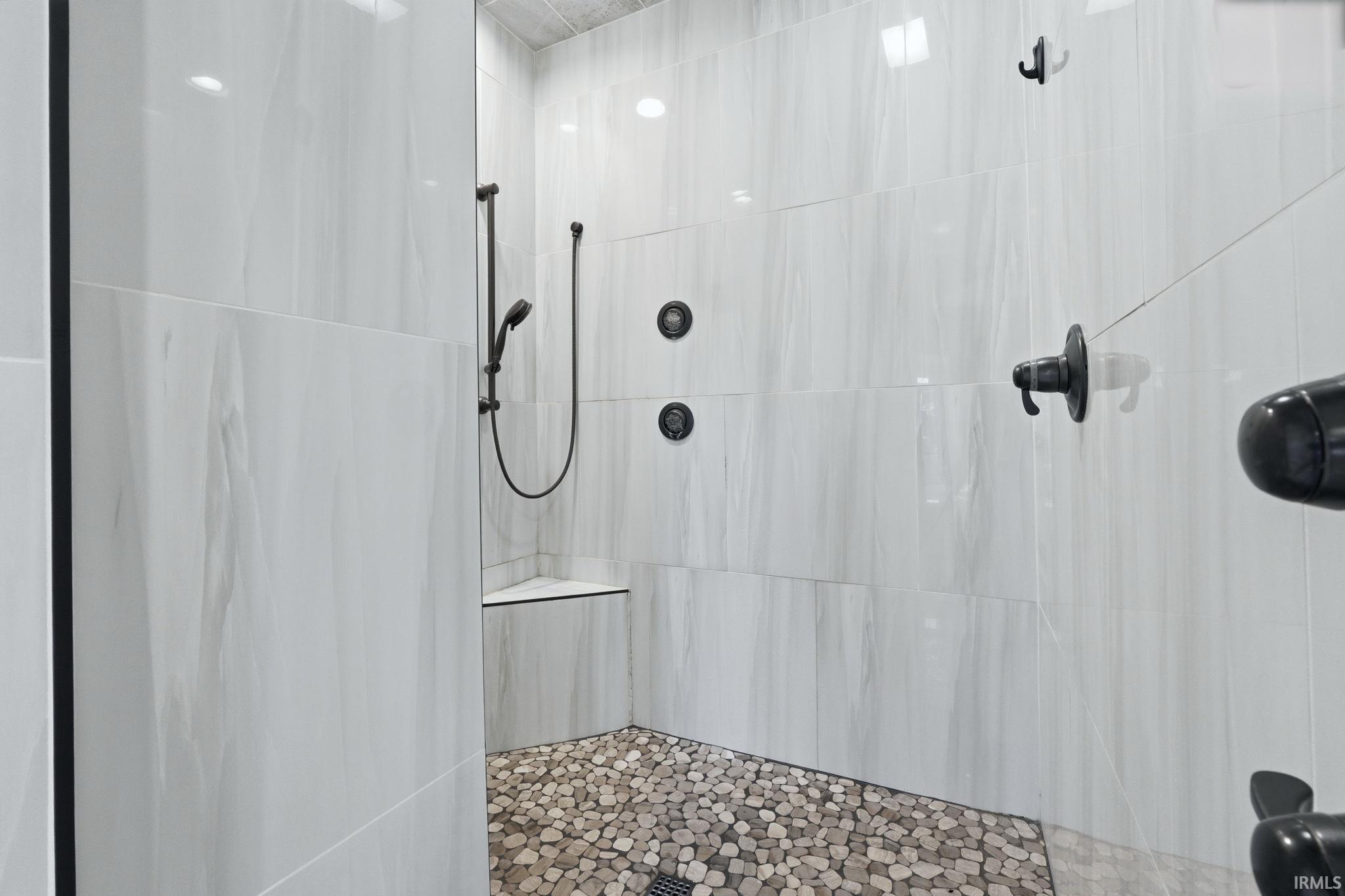 Full bath with tiled shower