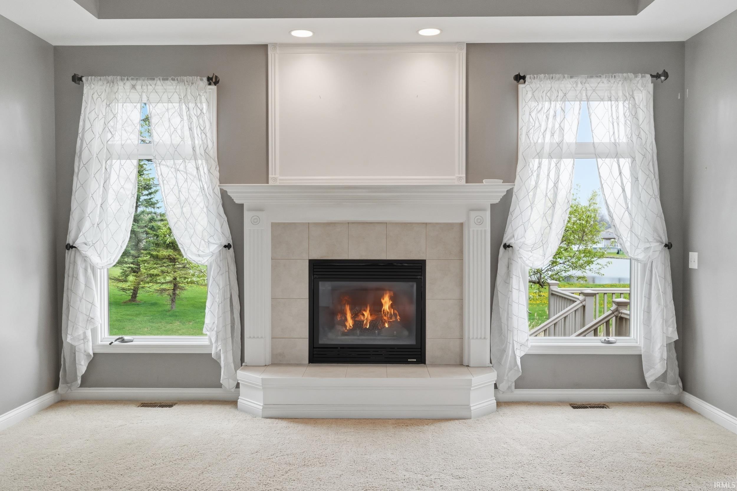 Detailed view of carpet floors and a fireplace