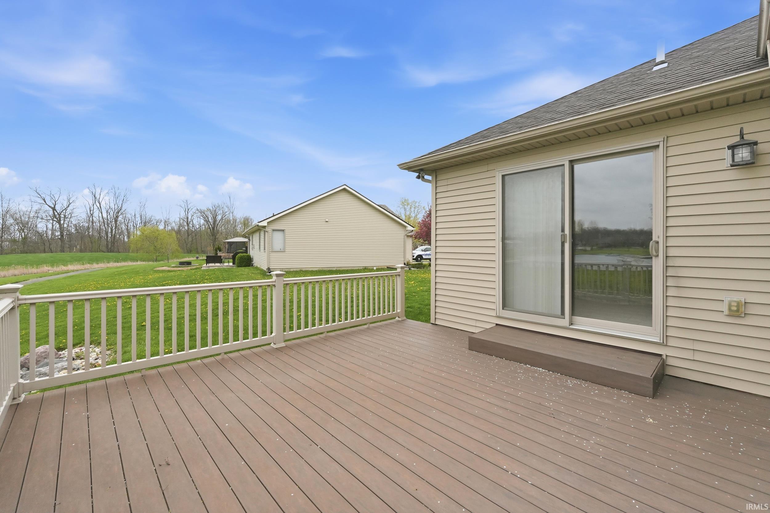 Wooden deck with a yard