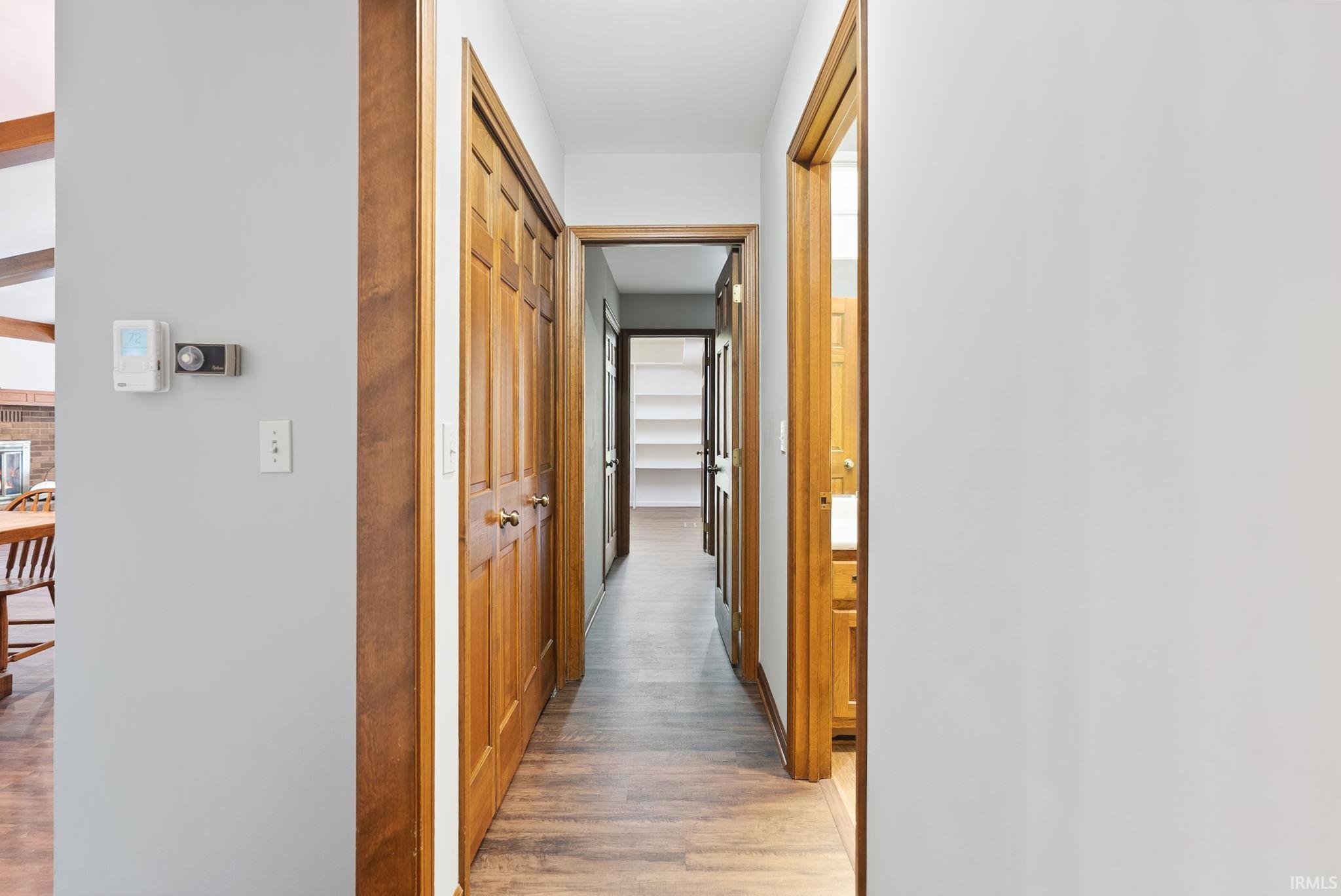 Hallway with light wood finished floors