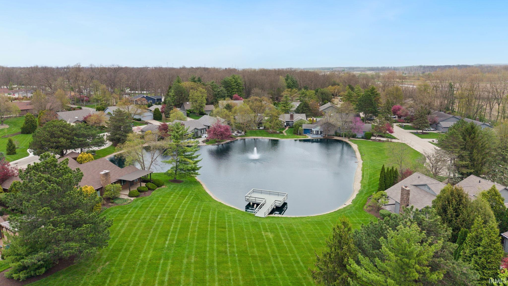 Aerial perspective of suburban area with a large body of water