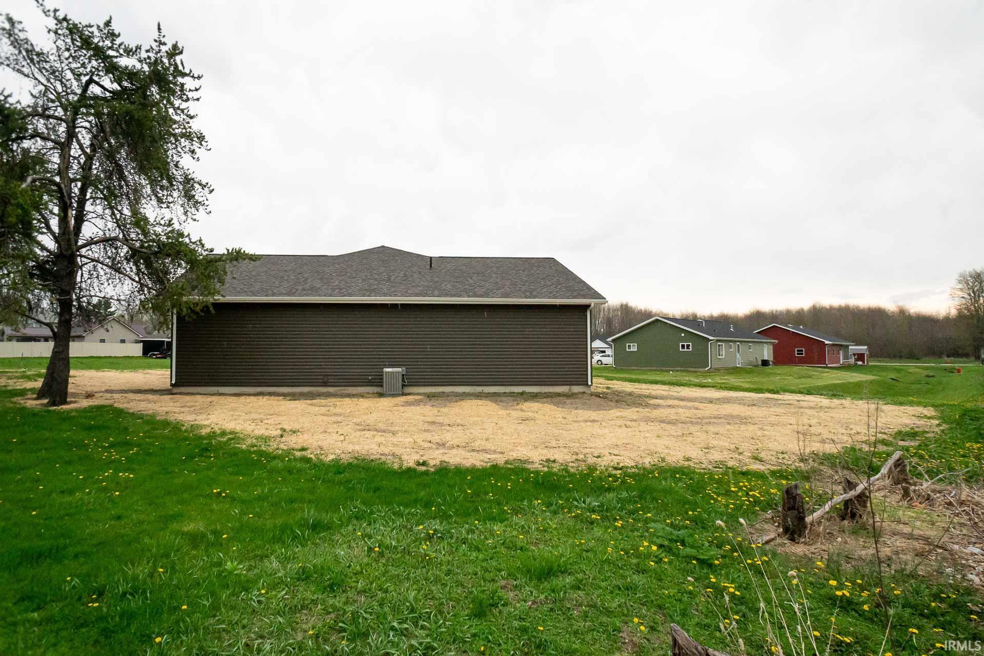 View of home's exterior with a lawn