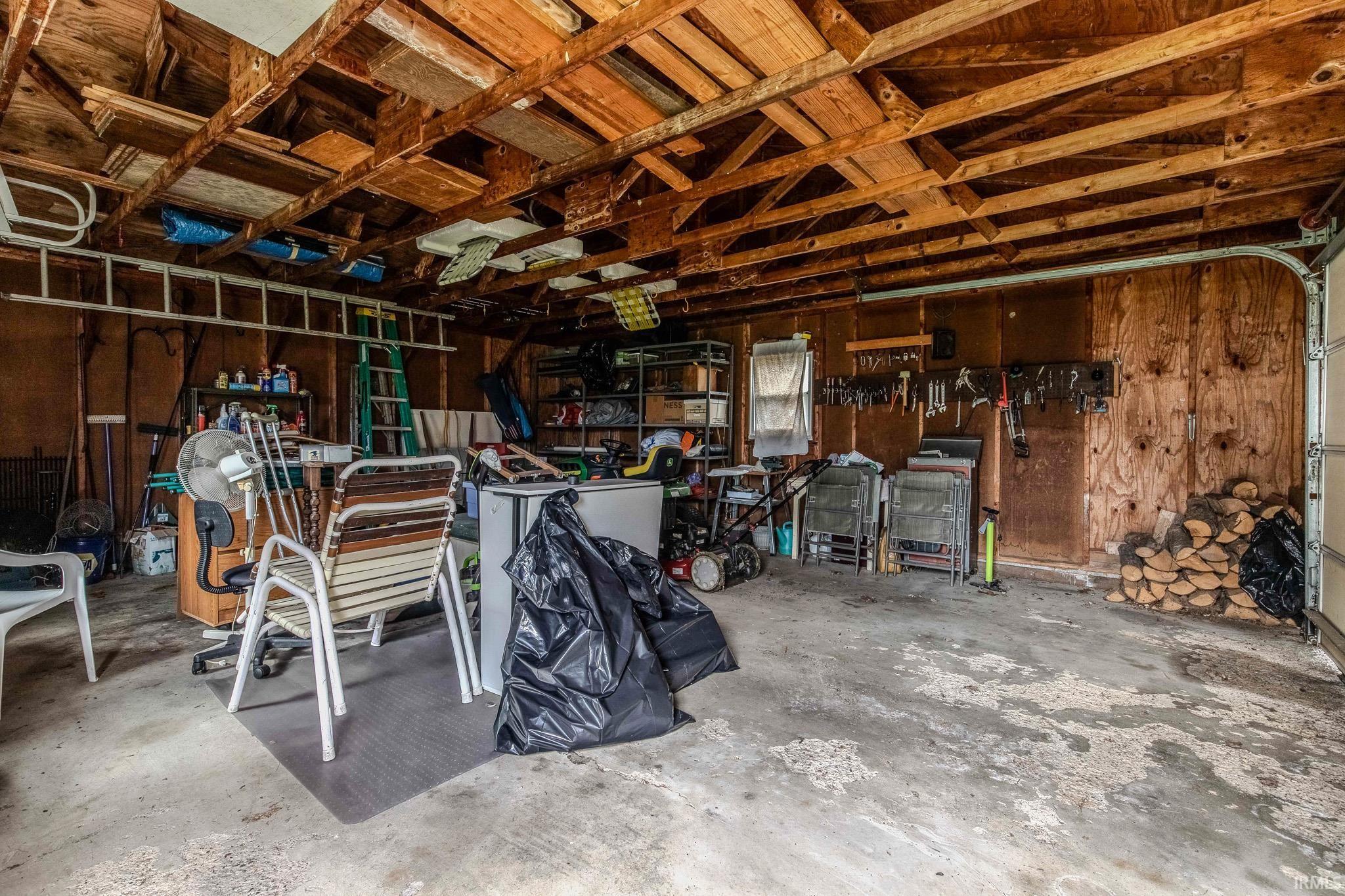 Garage featuring wood walls