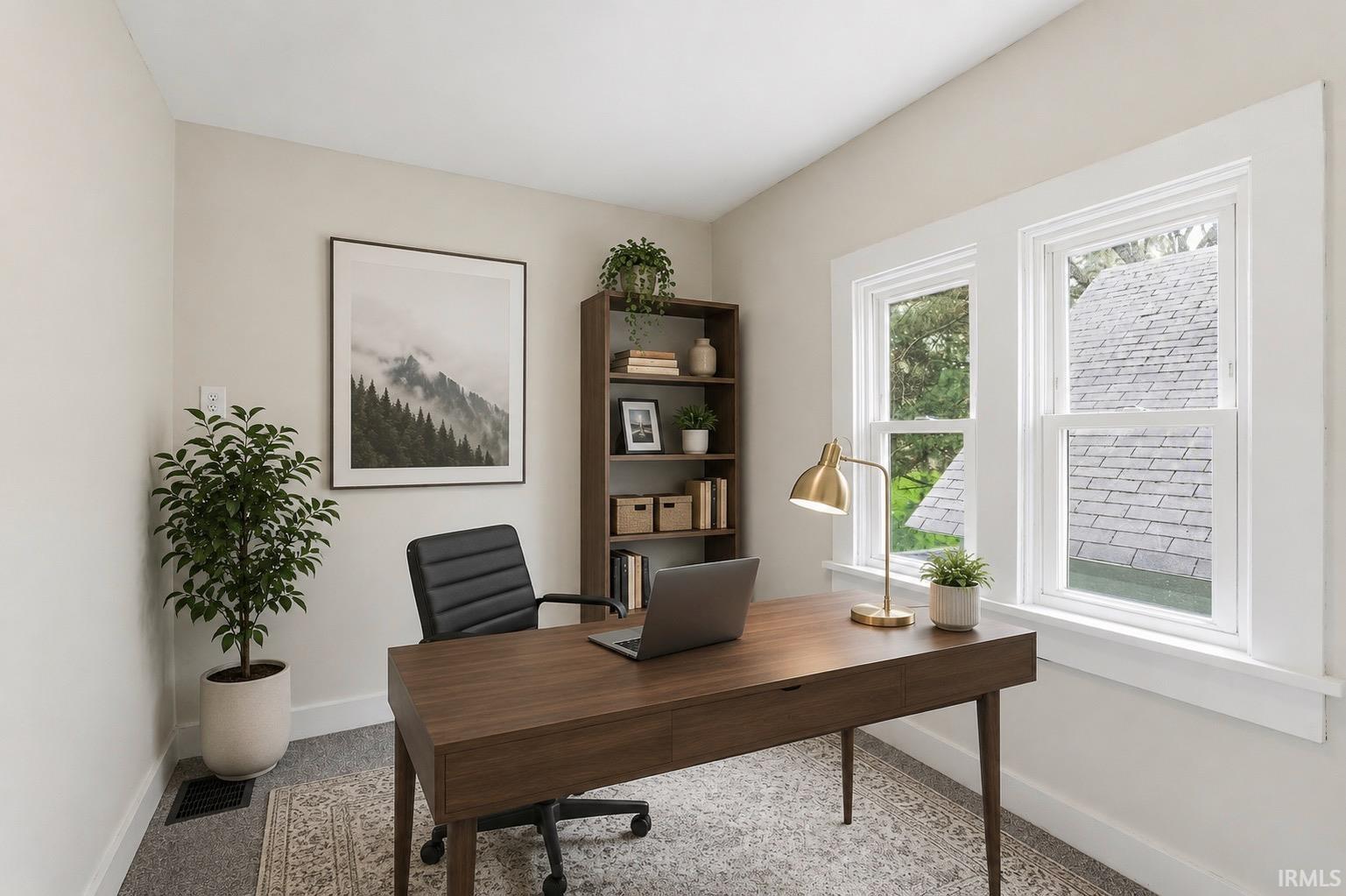 Naturally illuminated room featuring two large windows with white trim