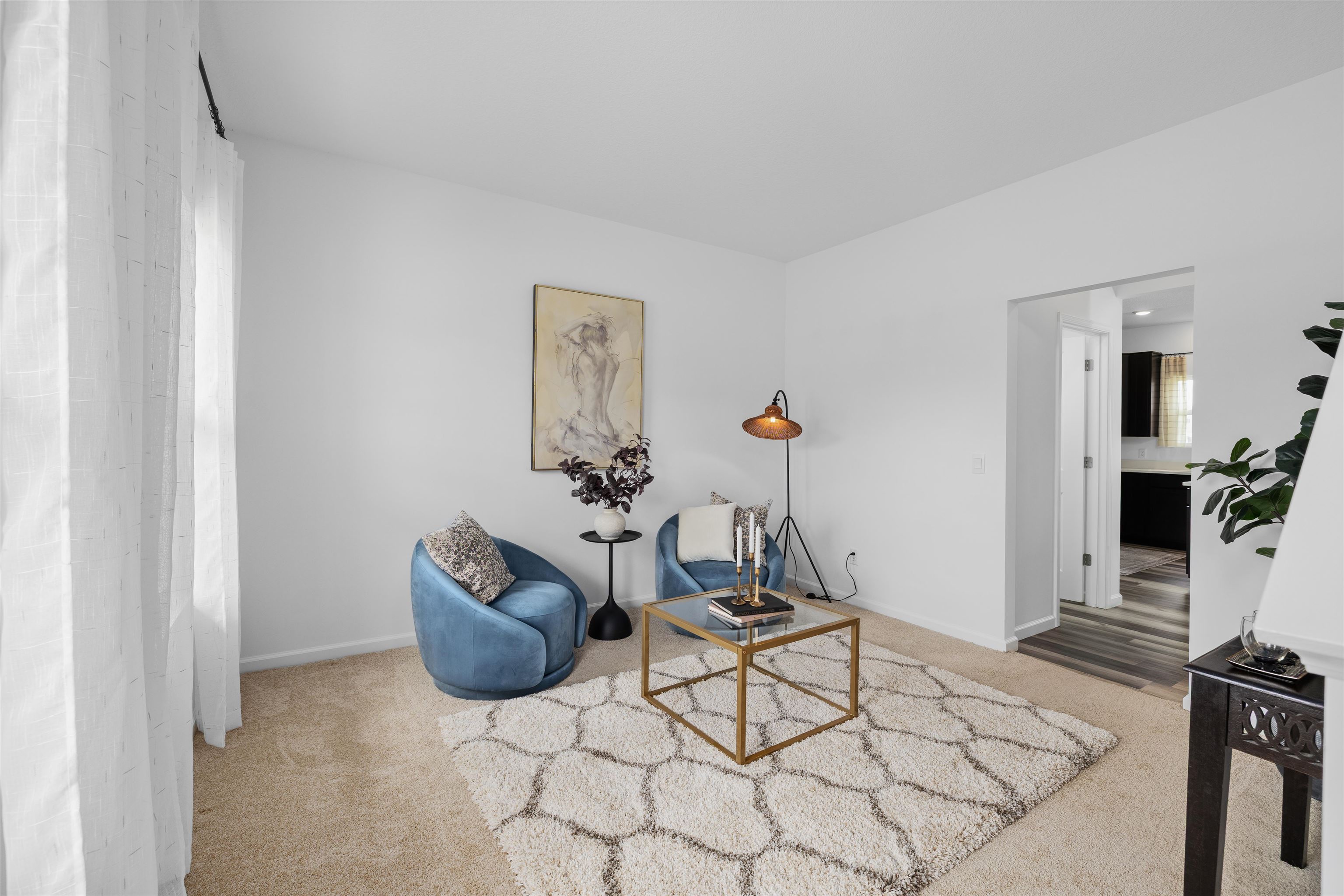 Carpeted interior space with neutral wall tones
