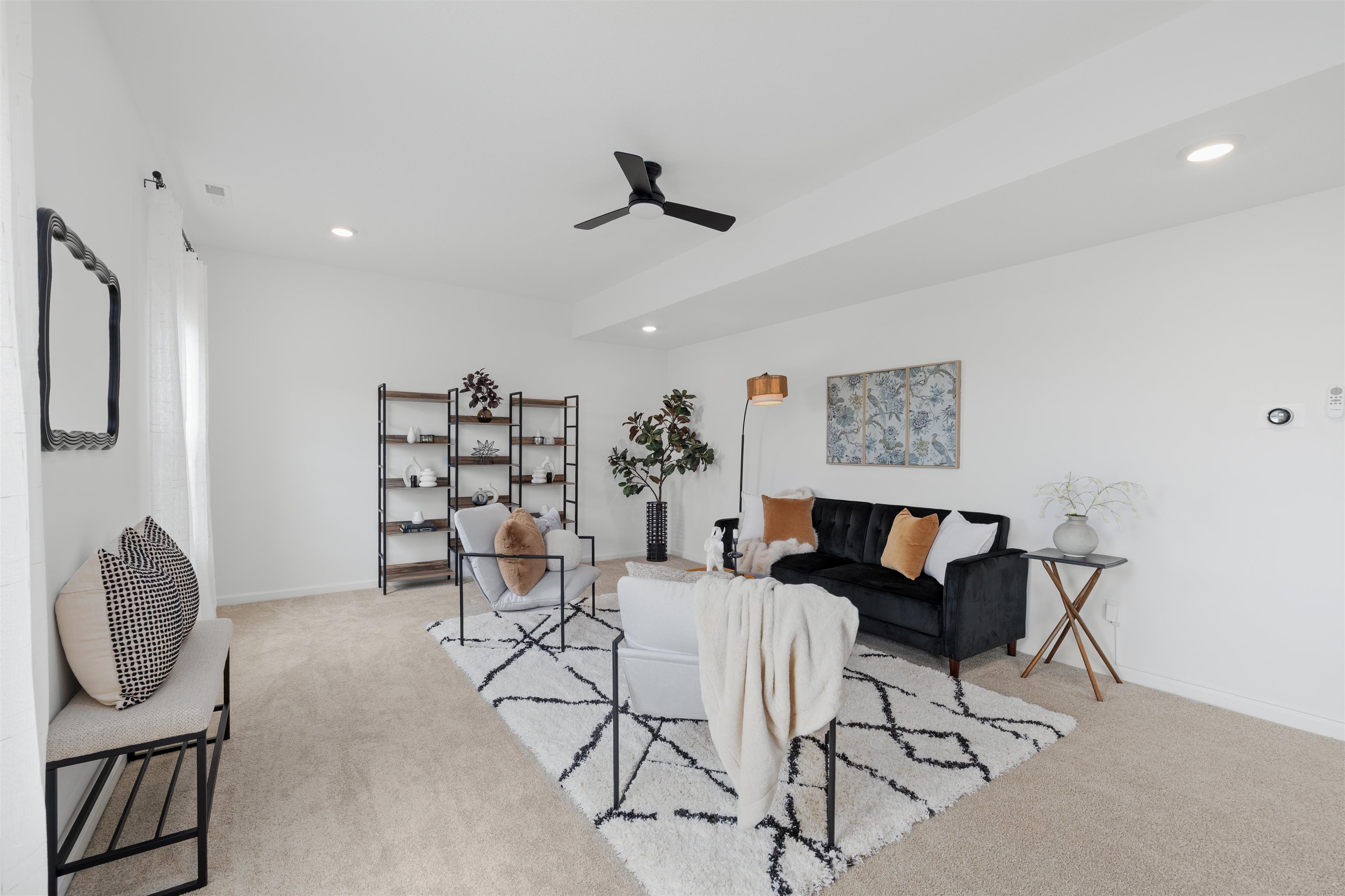 Spacious room featuring neutral carpeting, a ceiling fan with integrated lighting, recessed lighting, and white walls