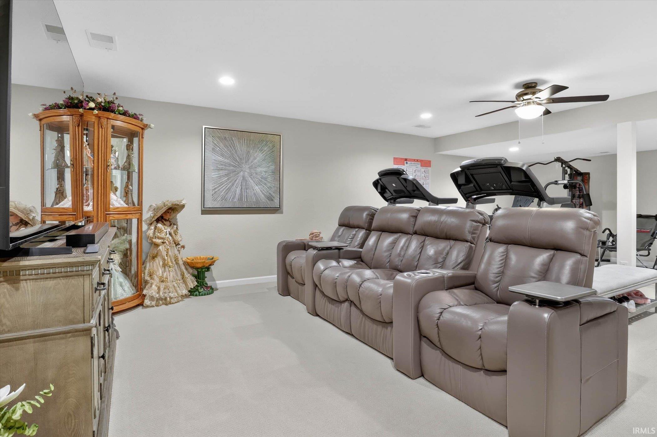 Family room featuring ceiling fan, light carpet, and recessed lighting