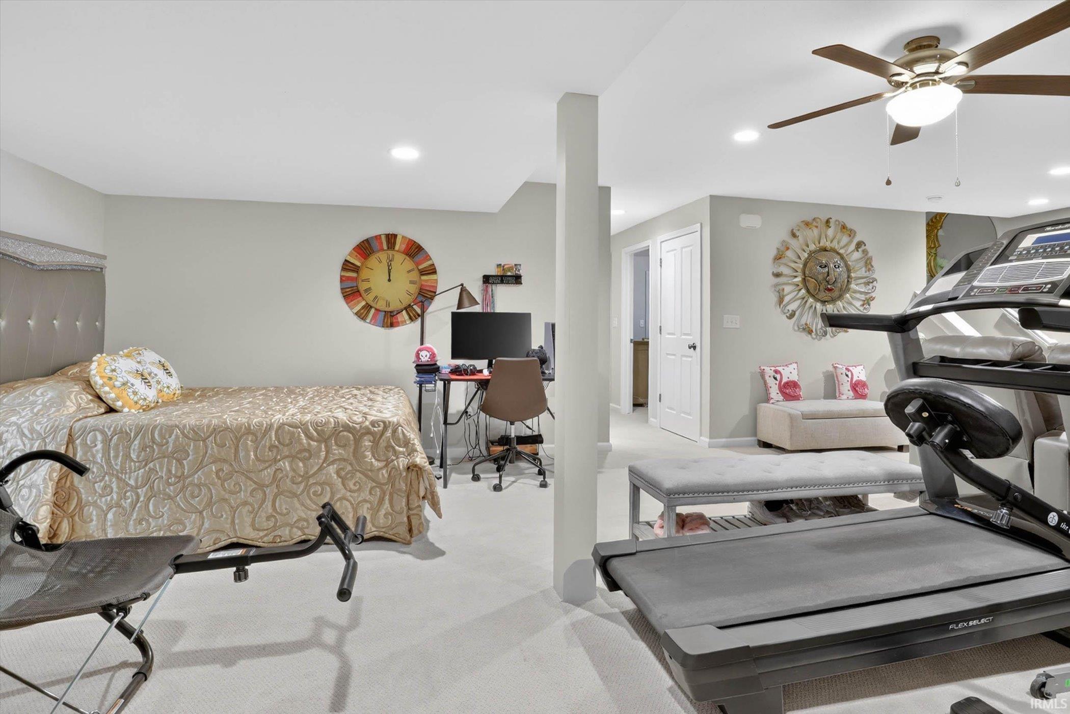 Bedroom featuring a desk, light colored carpet, recessed lighting, and a ceiling fan
