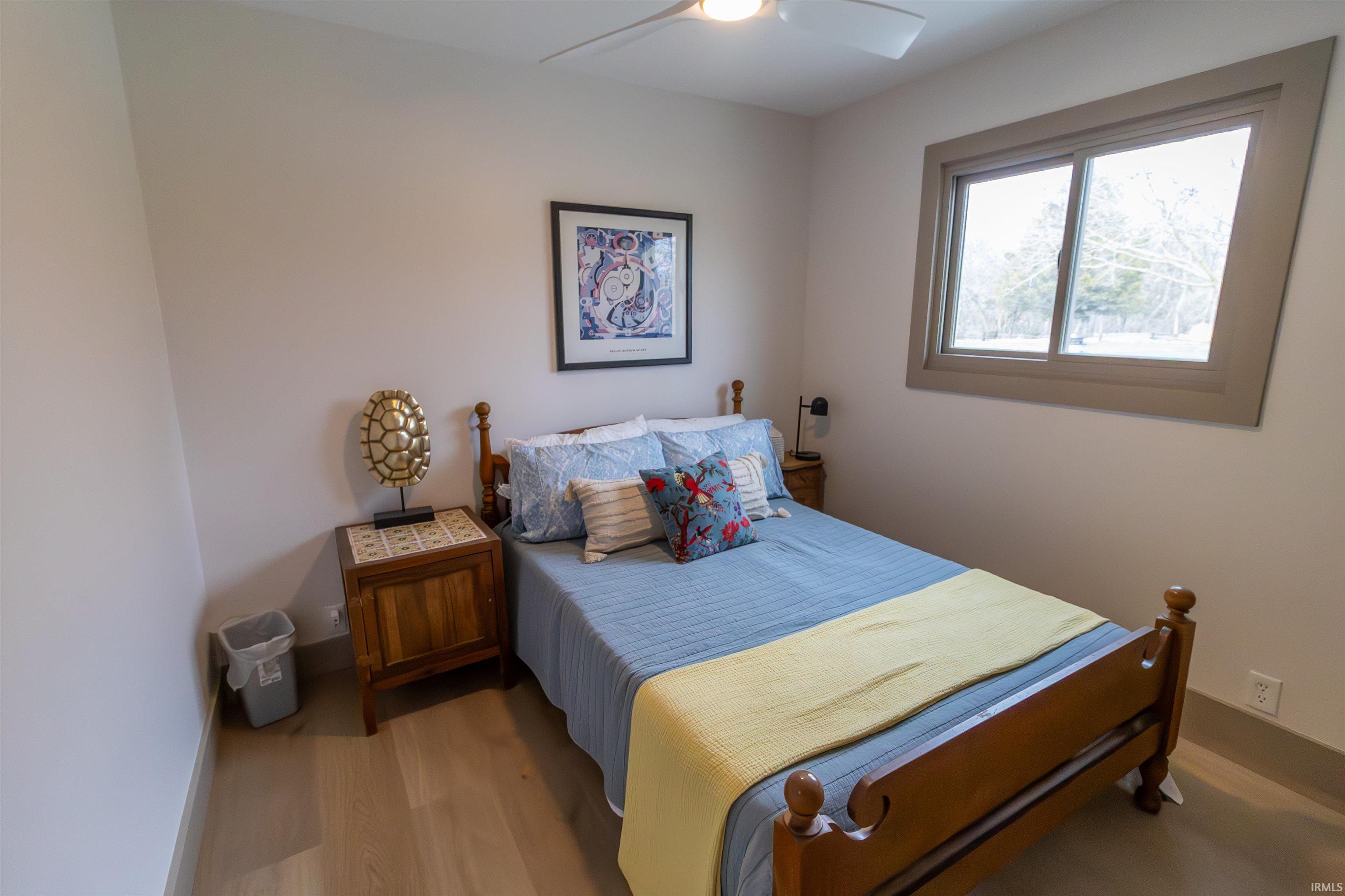 Bedroom featuring a ceiling fan and wood finished floors