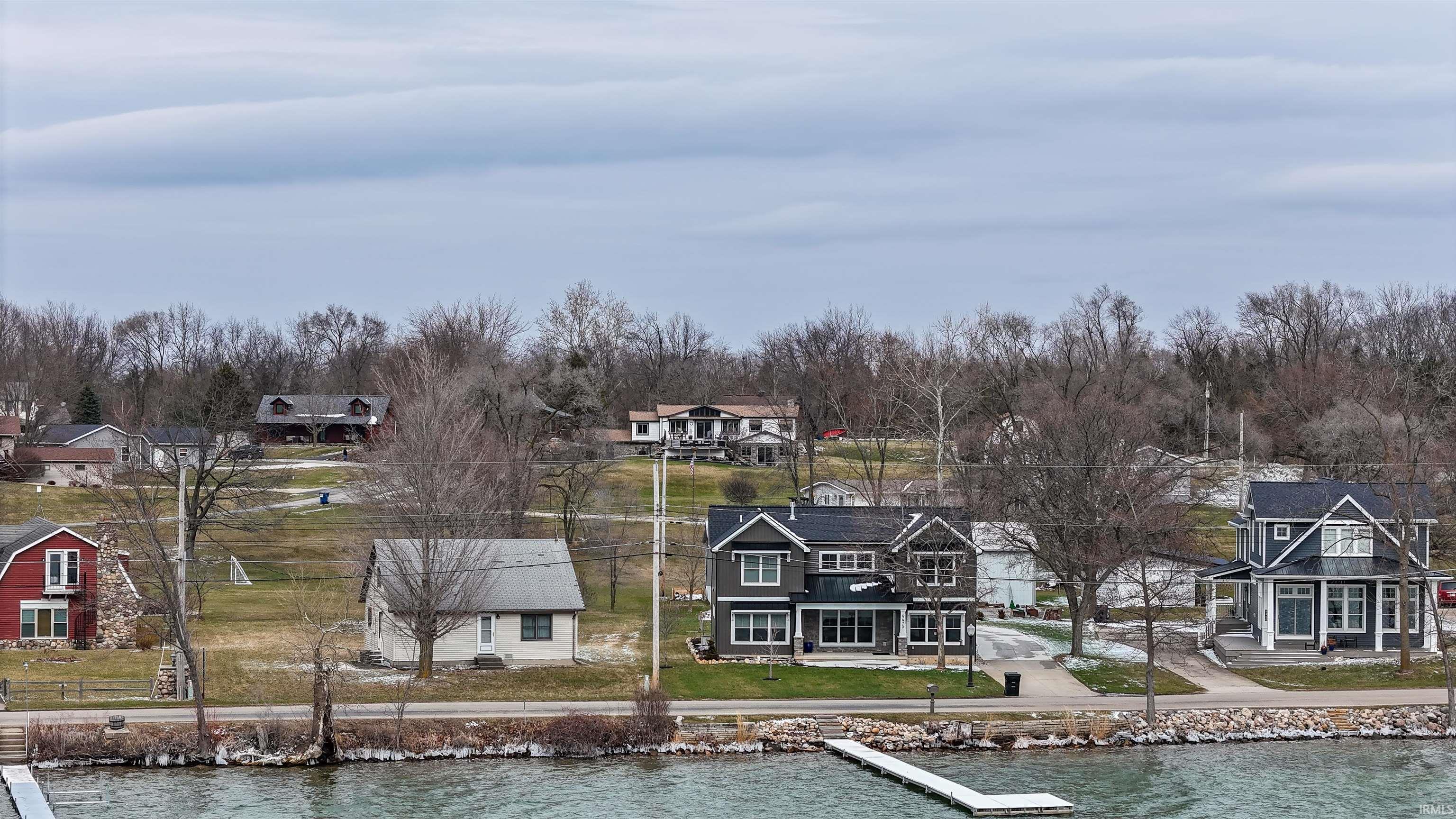 Aerial view of residential area with a large body of water