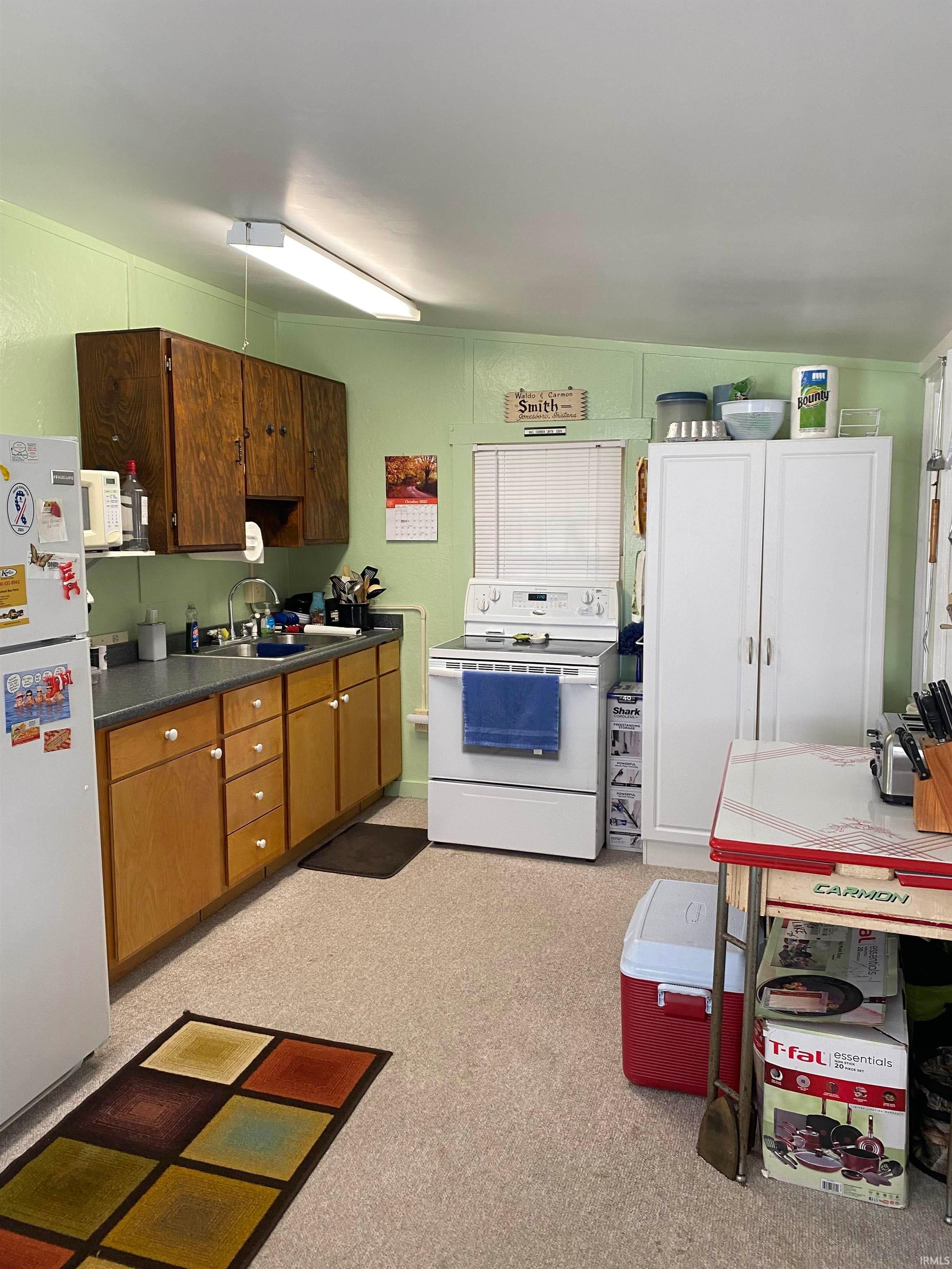 Kitchen featuring white cabinetry