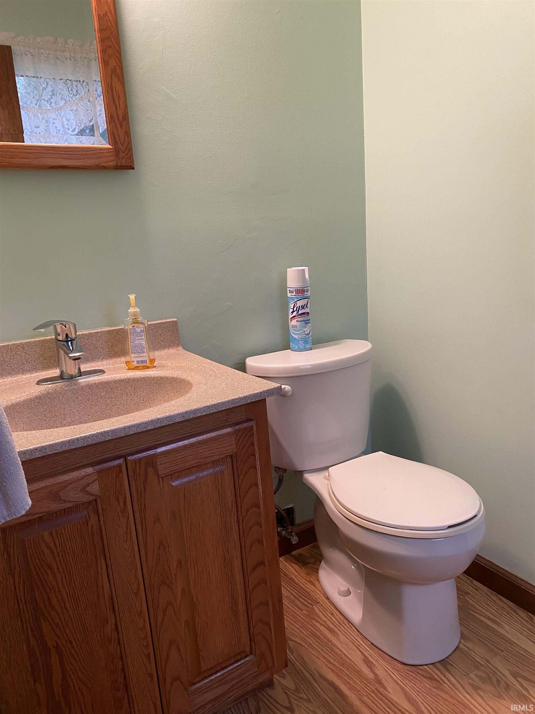 Bathroom with vanity and light wood-type flooring