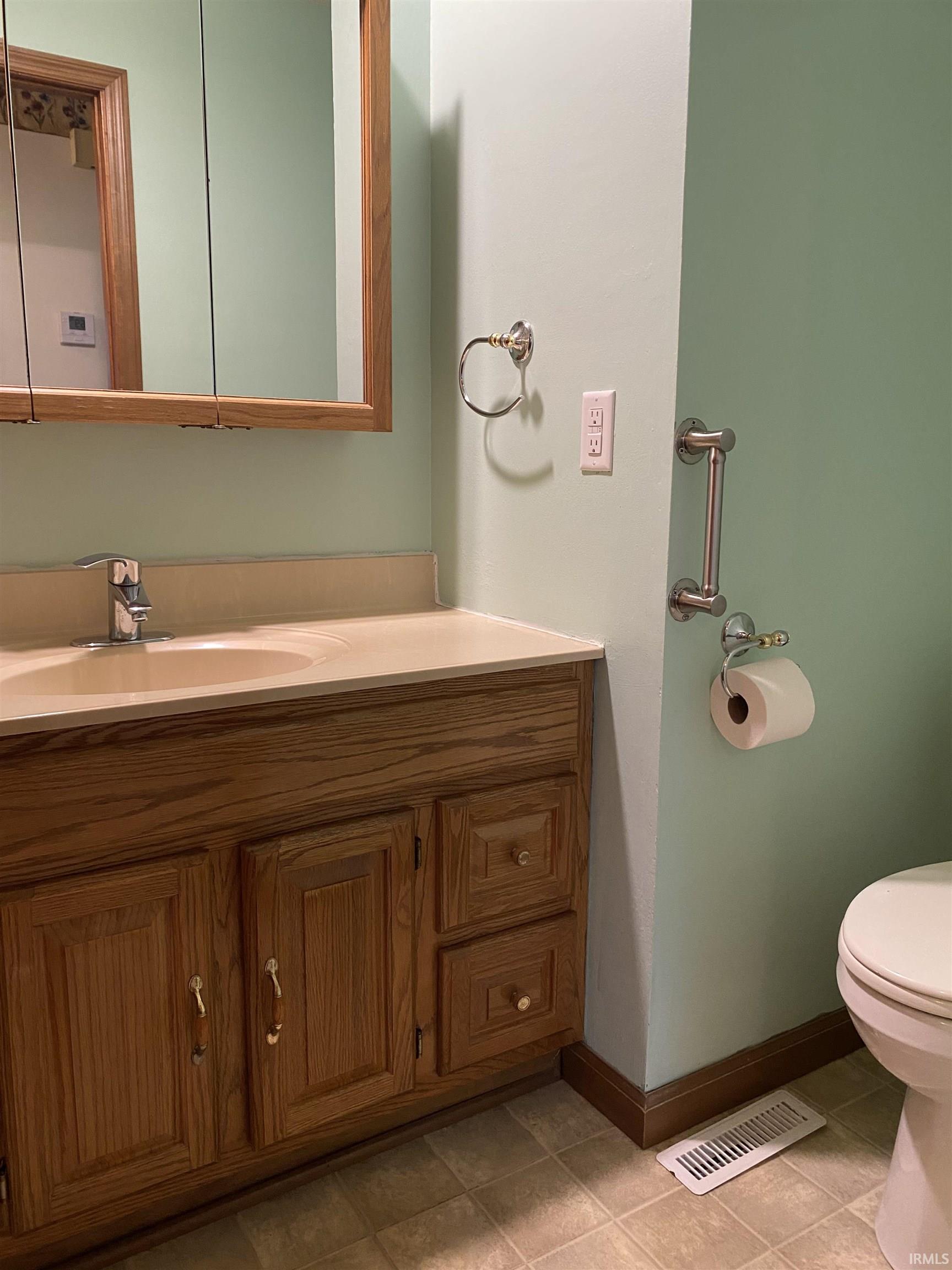 Half bathroom with vanity.