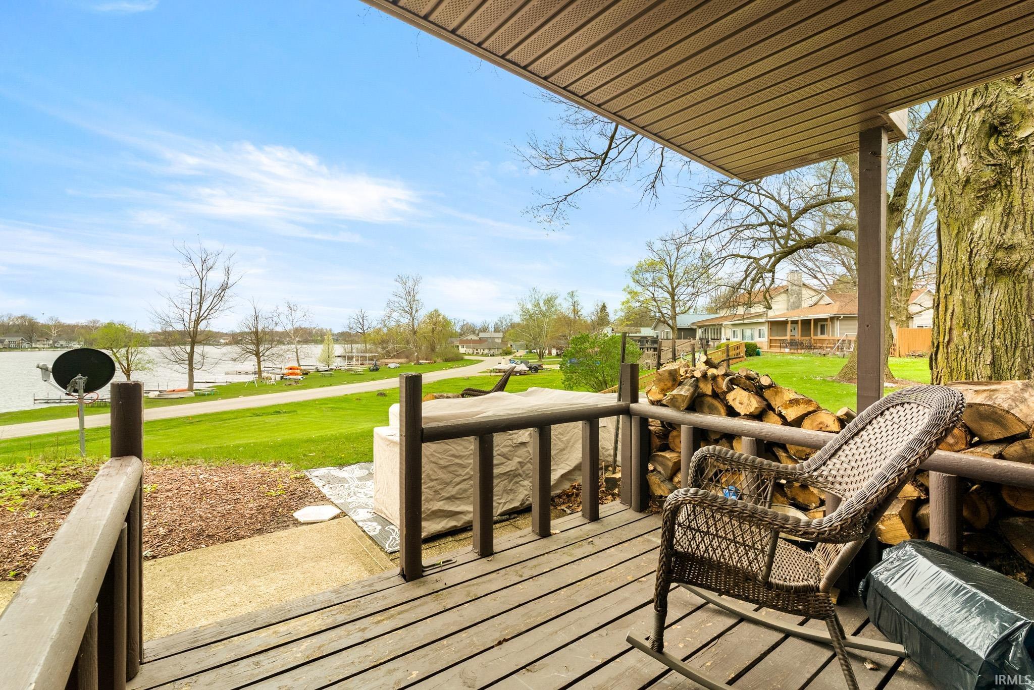 Wooden terrace featuring a lawn