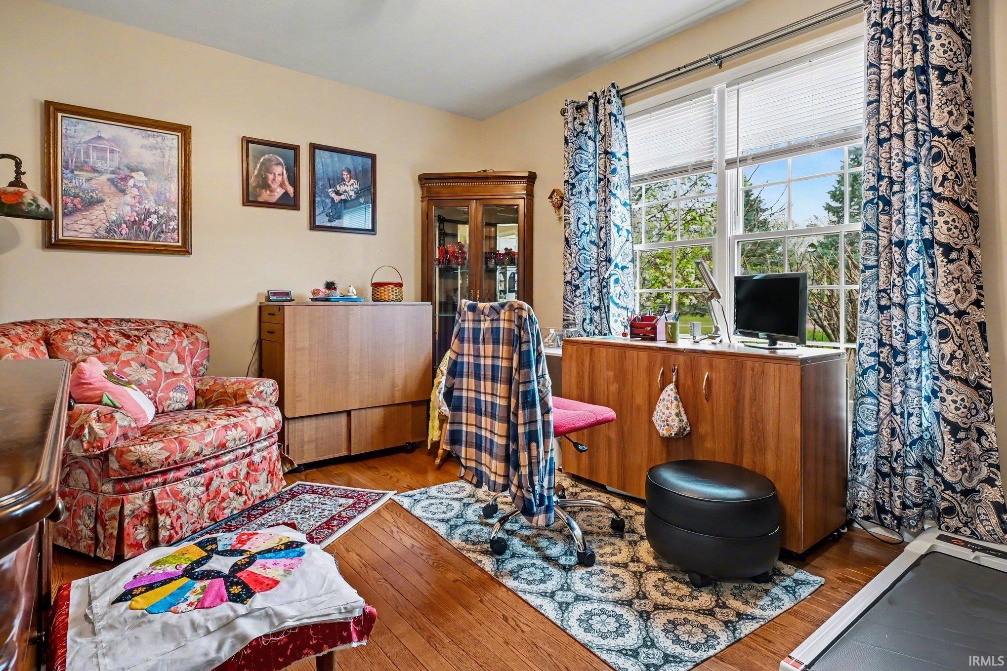Living area featuring hardwood / wood-style floors
