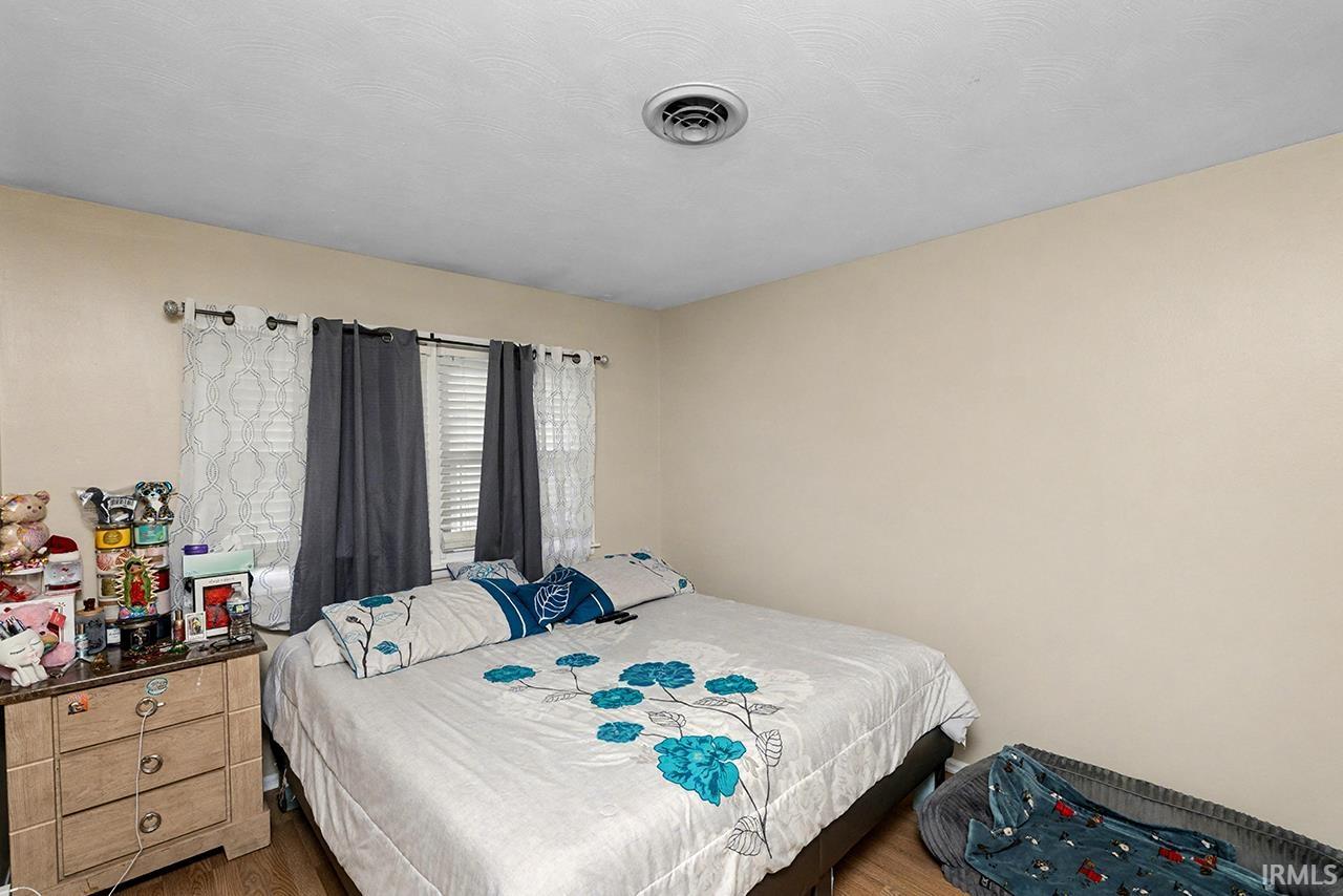 Bedroom with wood finished floors