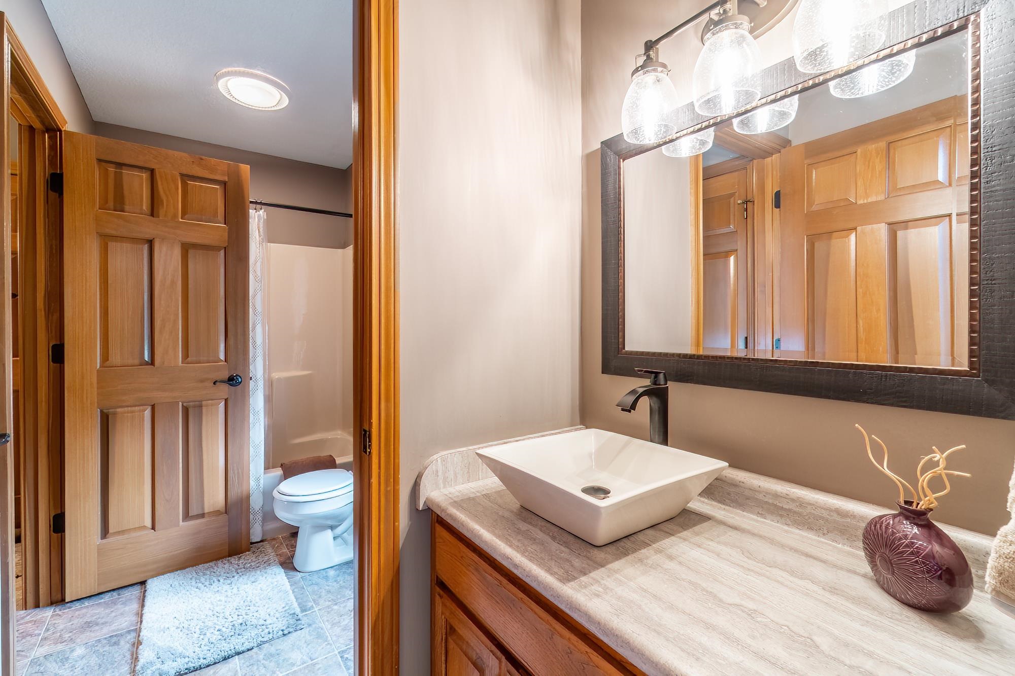 Full bathroom featuring vanity and shower / bath combo with shower curtain