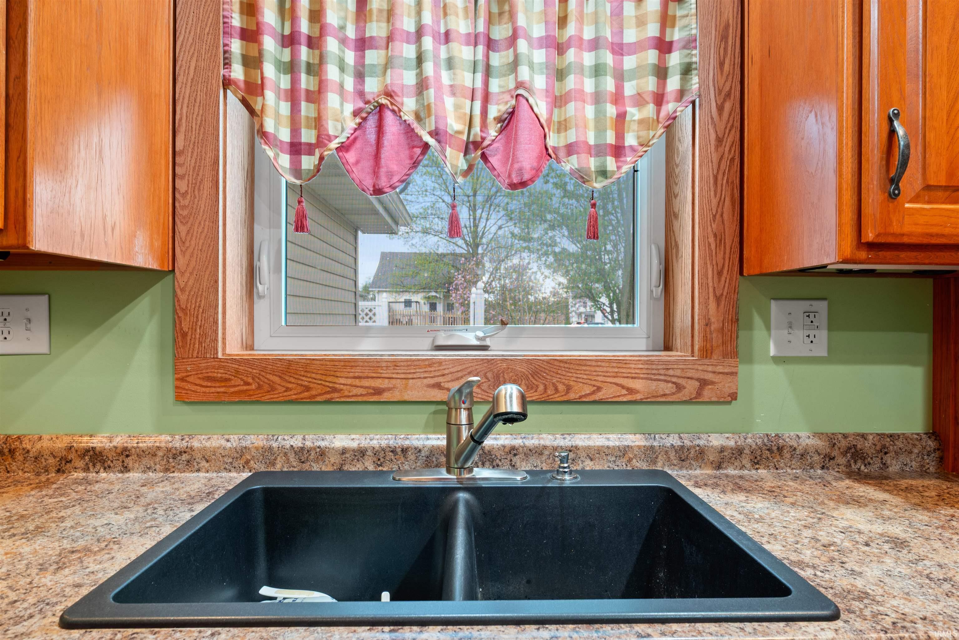 Kitchen view of wood finish cabinetry