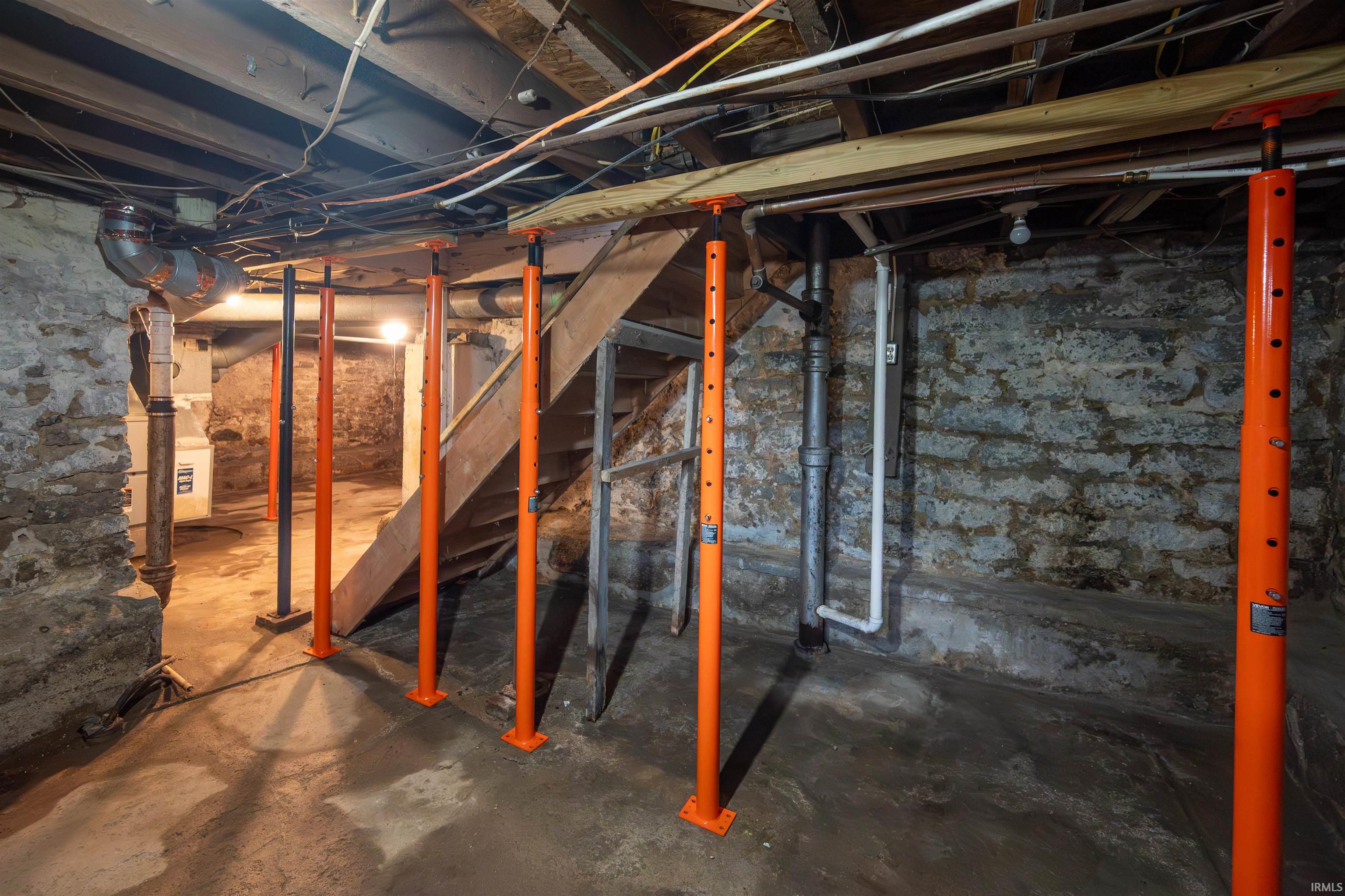 Unfinished basement with stairs